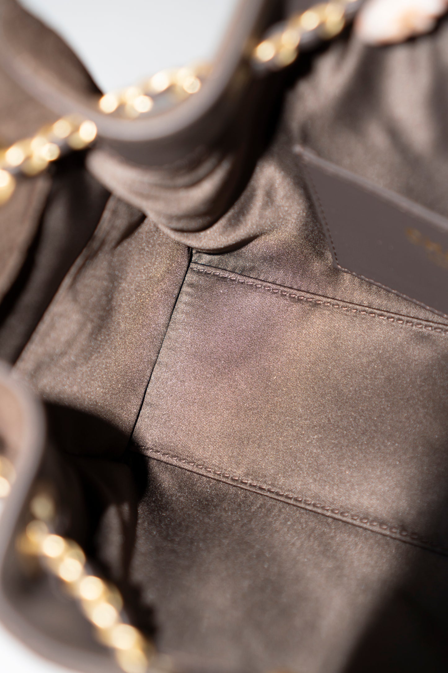 C25 Mini Drawstring Chain Bag – Dark Brown Suede with Gold Hardware
