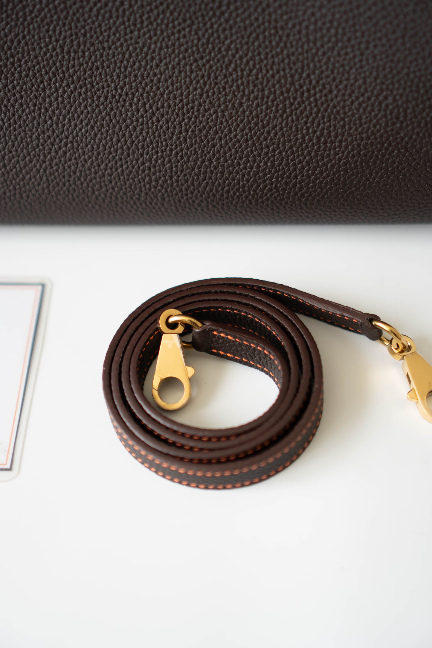 Kelly 40 HSS Special Order – Ebene Togo with Orange Interior