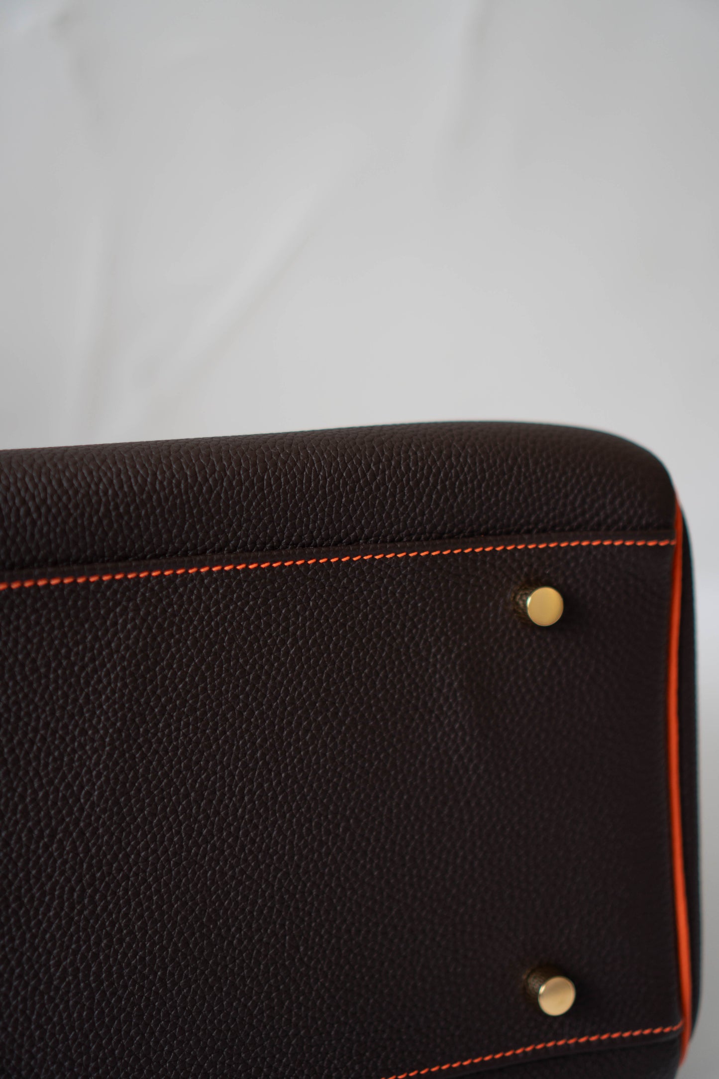 Kelly 40 HSS Special Order – Ebene Togo with Orange Interior
