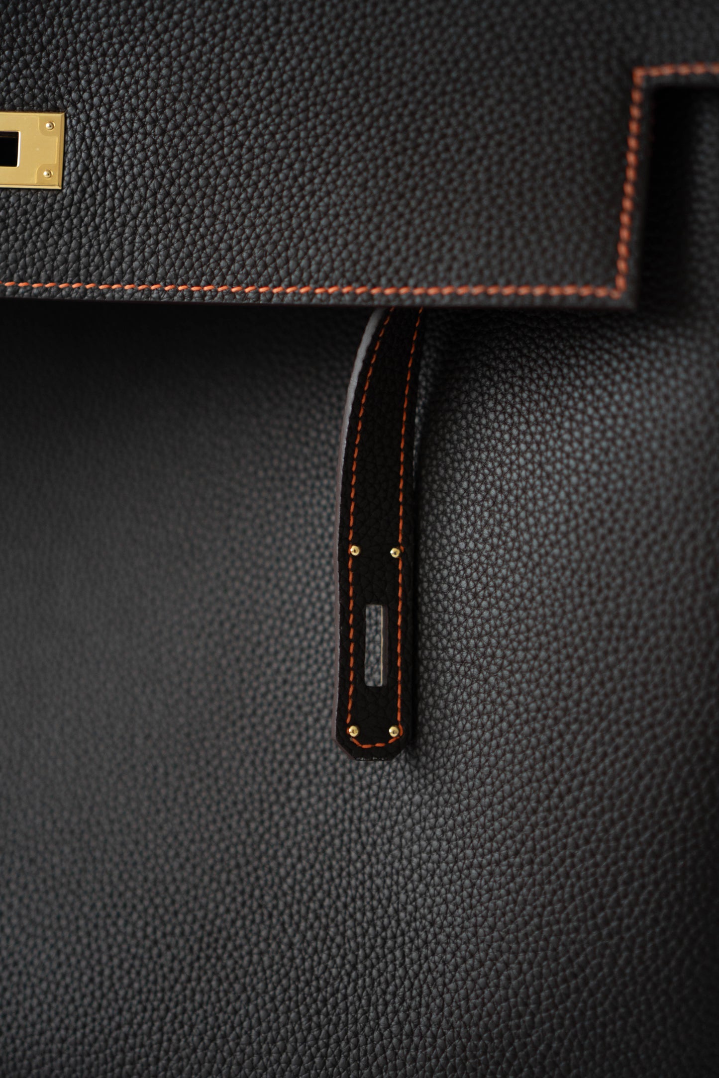 Kelly 40 HSS Special Order – Ebene Togo with Orange Interior