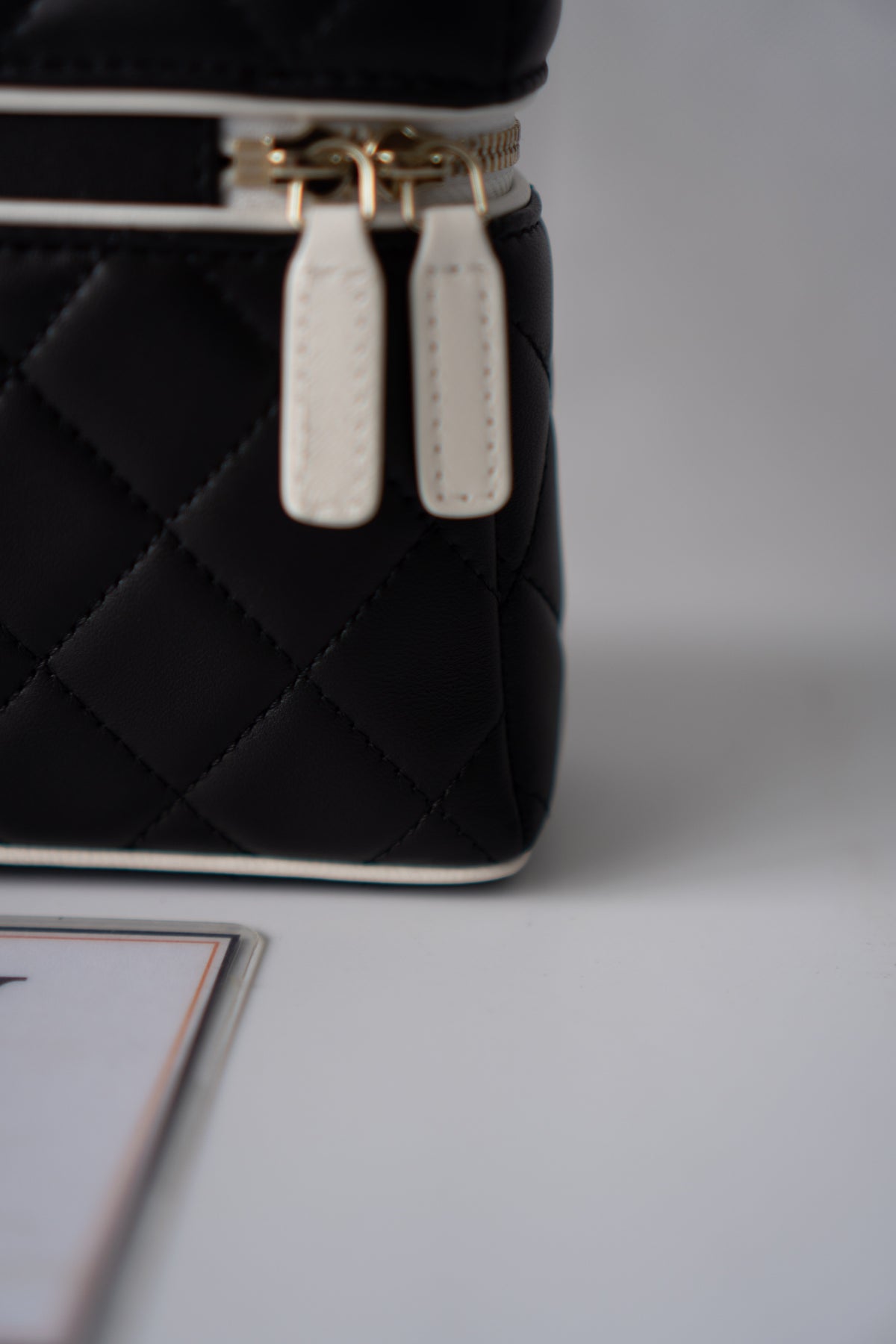 Small Vanity Chain Case – Black Quilted Lambskin with White Piping