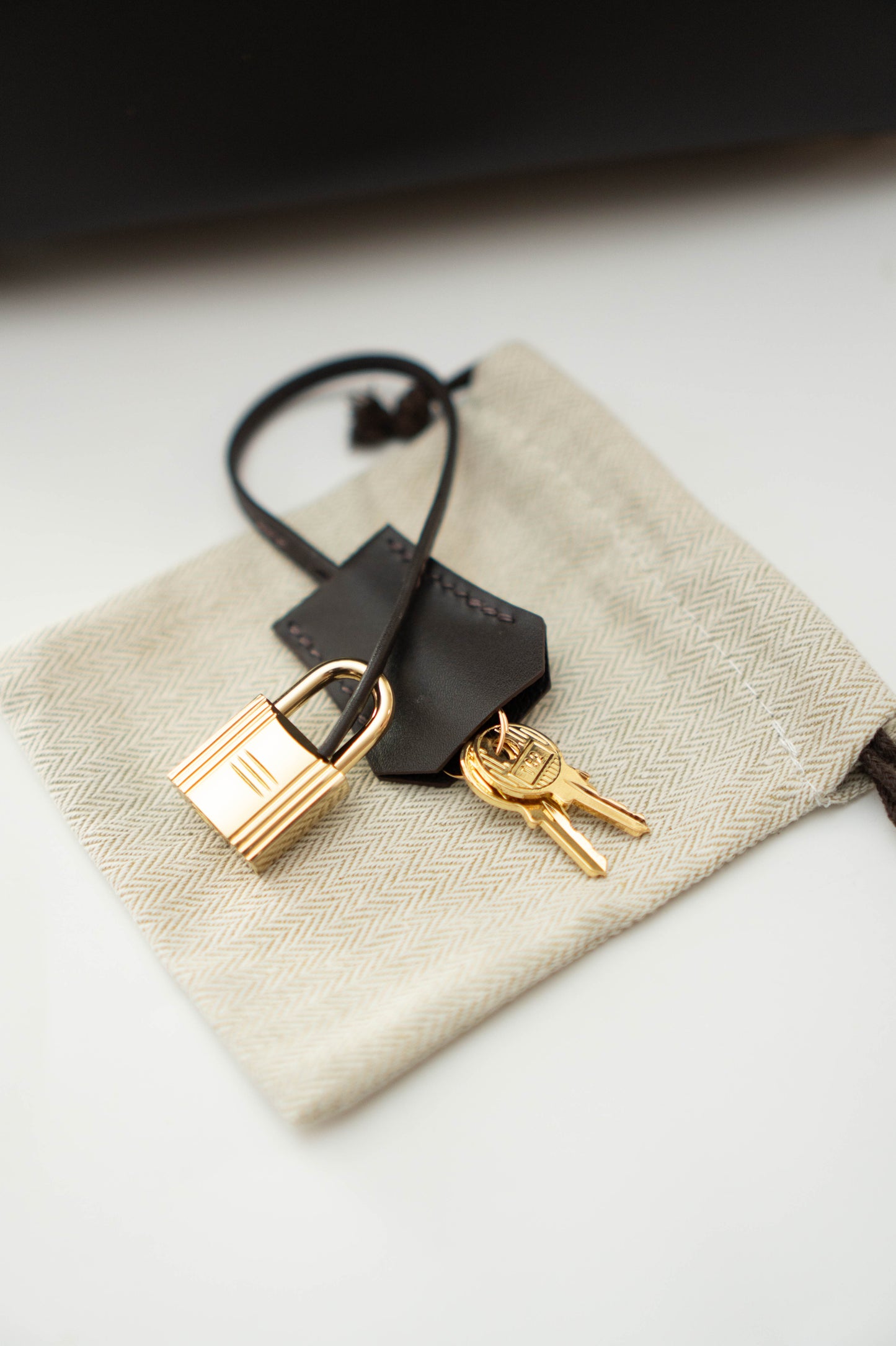 Birkin 25 in Ebene Permabrass Hardware