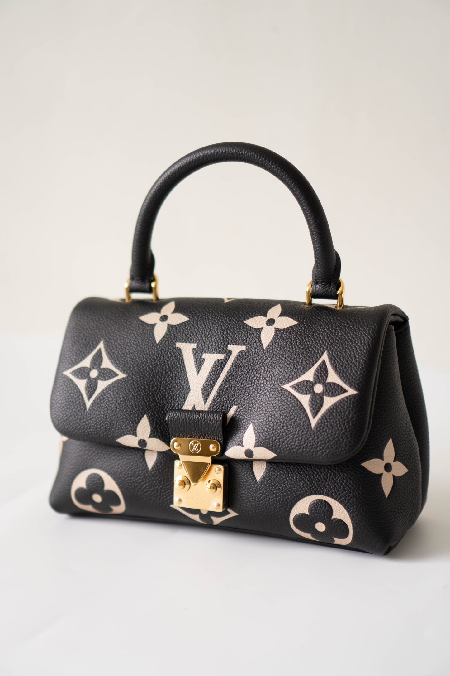 Madeleine BB in Black Bicolor Monogram Empreinte Leather in Gold Hardware