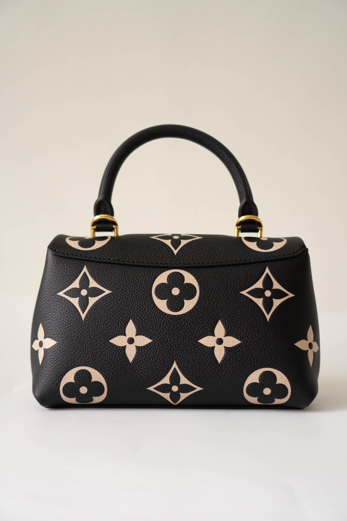 Madeleine BB in Black Bicolor Monogram Empreinte Leather in Gold Hardware