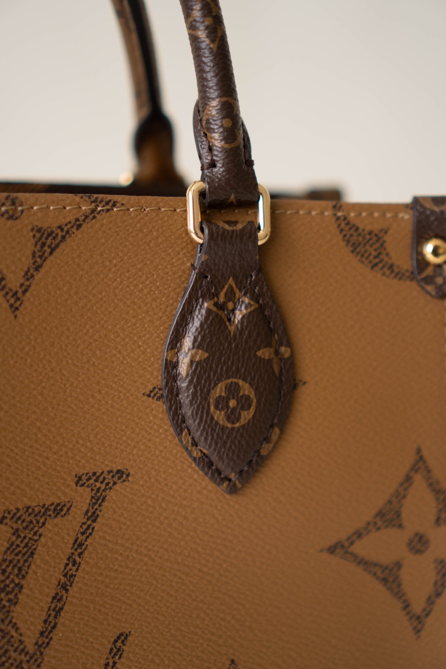 OnTheGo PM in Monogram & Reverse Monogram With Gold Hardware