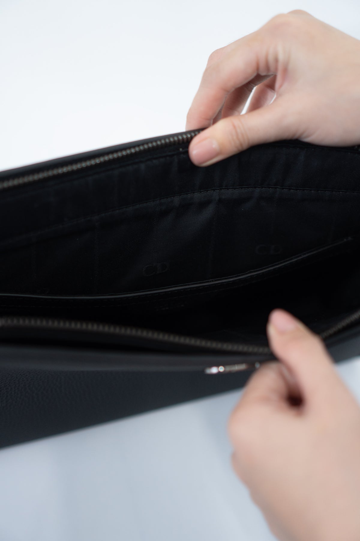CD Icon A5 Zipped Triangle Pouch – Black Grained Leather with Silver Hardware
