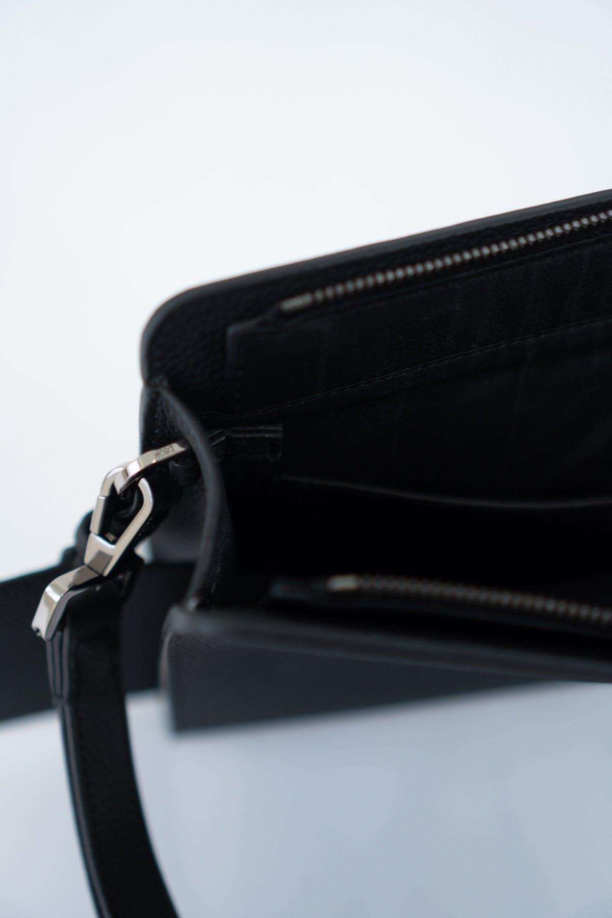 CD Icon A5 Zipped Triangle Pouch – Black Grained Leather with Silver Hardware