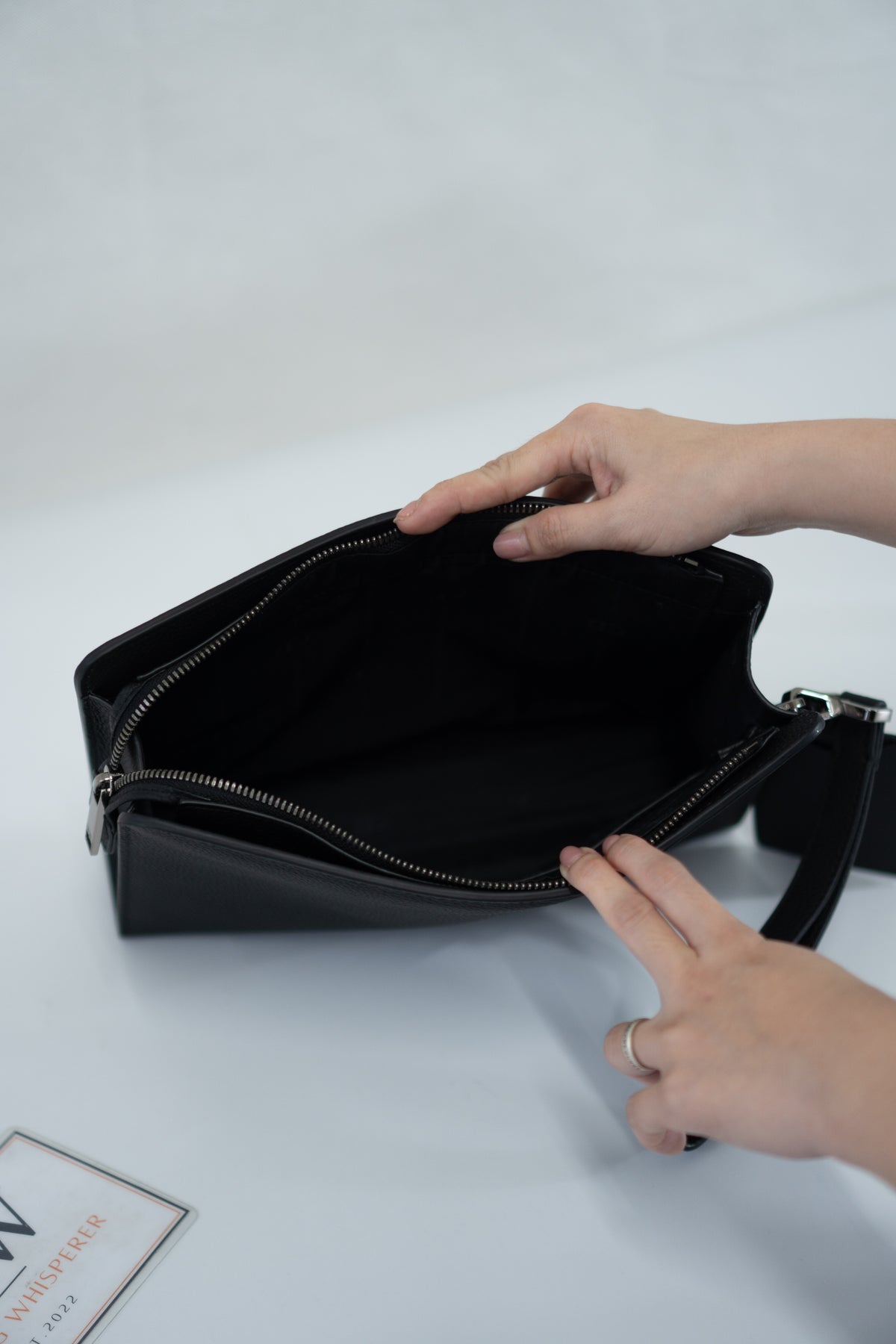 CD Icon A5 Zipped Triangle Pouch – Black Grained Leather with Silver Hardware