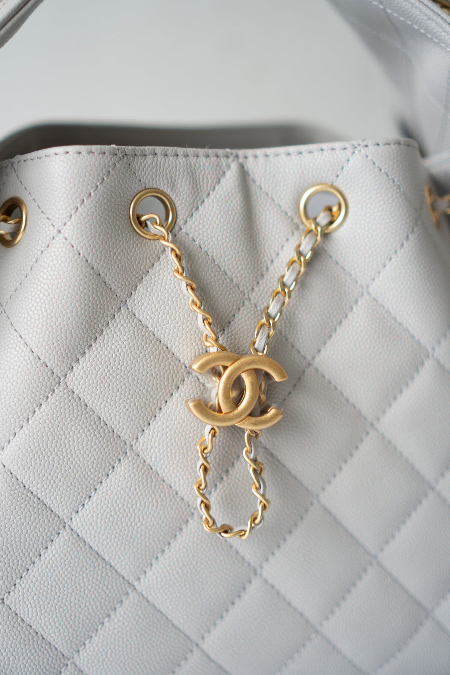 C25 Small Drawstring Chain Bag – Light Gray Caviar Leather with Gold Hardware