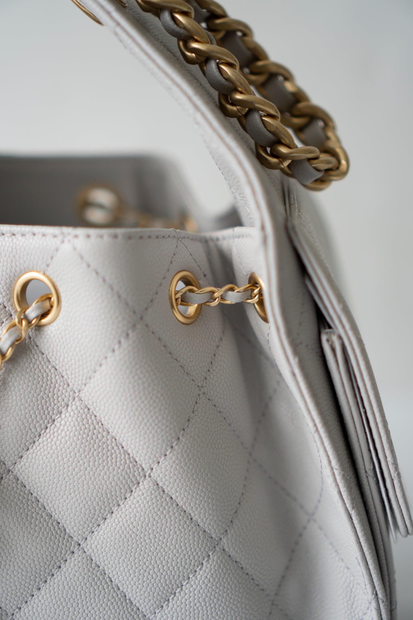 C25 Small Drawstring Chain Bag – Light Gray Caviar Leather with Gold Hardware