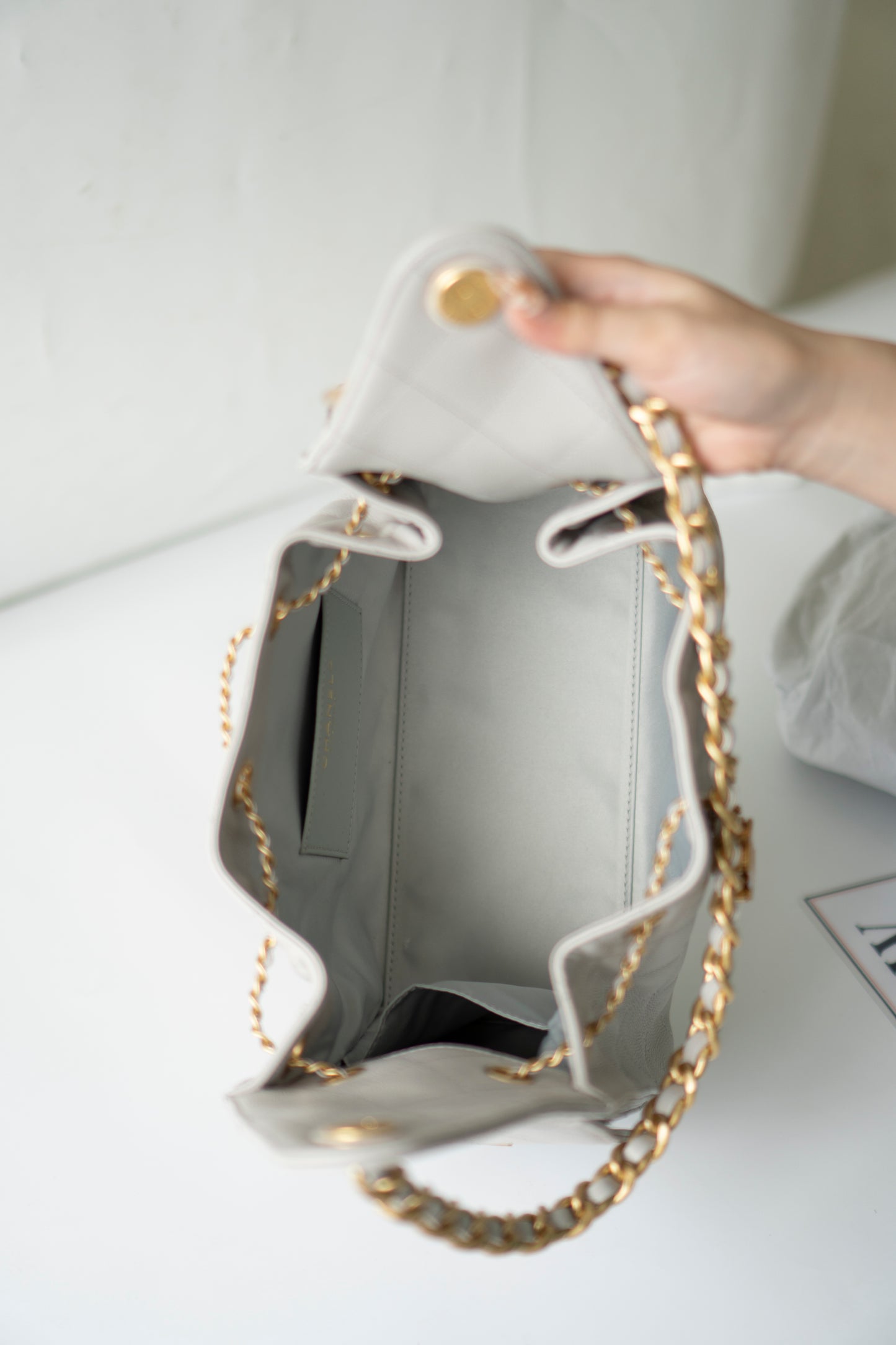 C25 Small Drawstring Chain Bag – Light Gray Caviar Leather with Gold Hardware