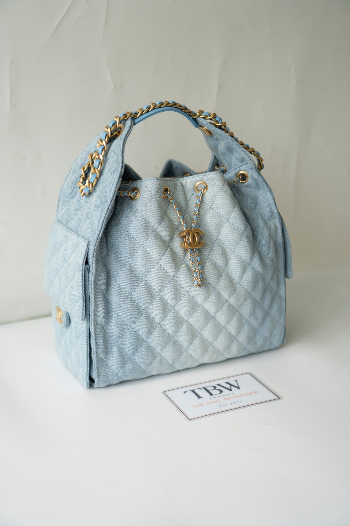 C25 Medium Drawstring Chain Bag – Washed Denim with Gold Hardware