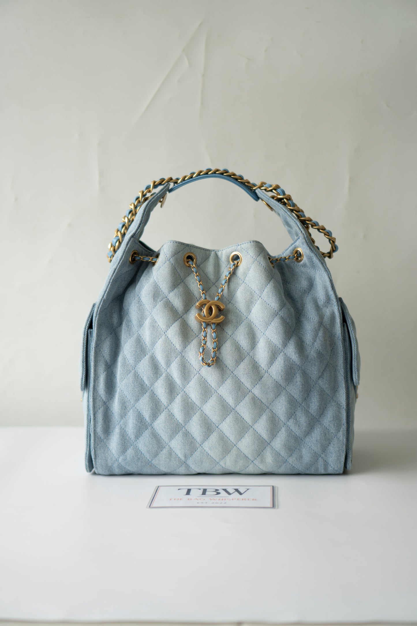 C25 Medium Drawstring Chain Bag – Washed Denim with Gold Hardware