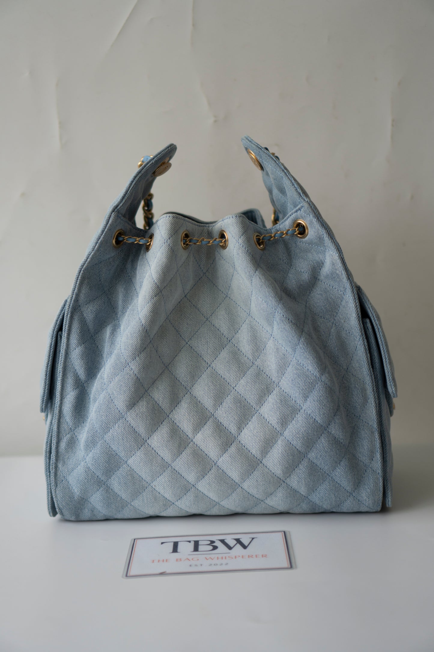 C25 Medium Drawstring Chain Bag – Washed Denim with Gold Hardware