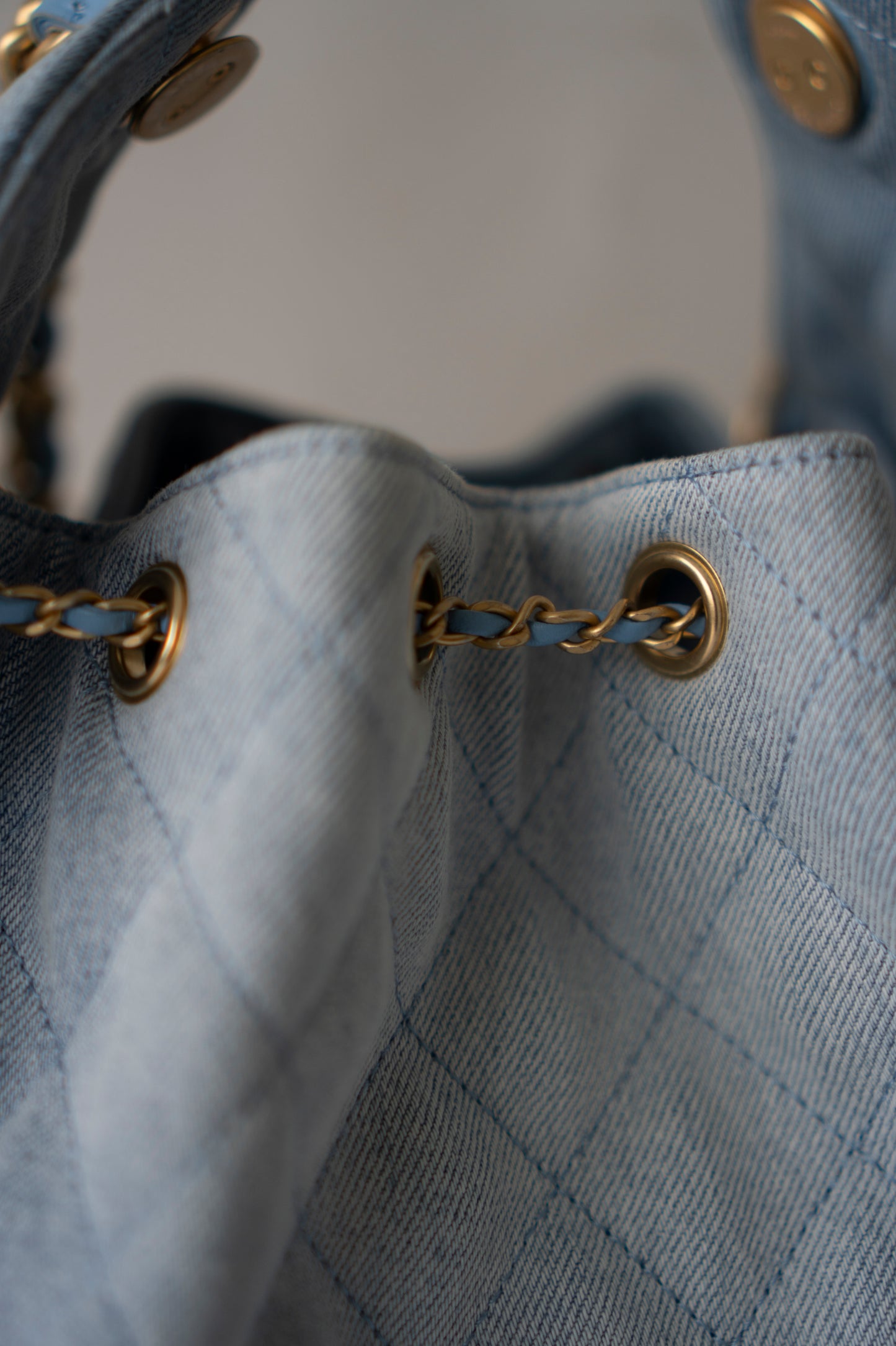 C25 Medium Drawstring Chain Bag – Washed Denim with Gold Hardware