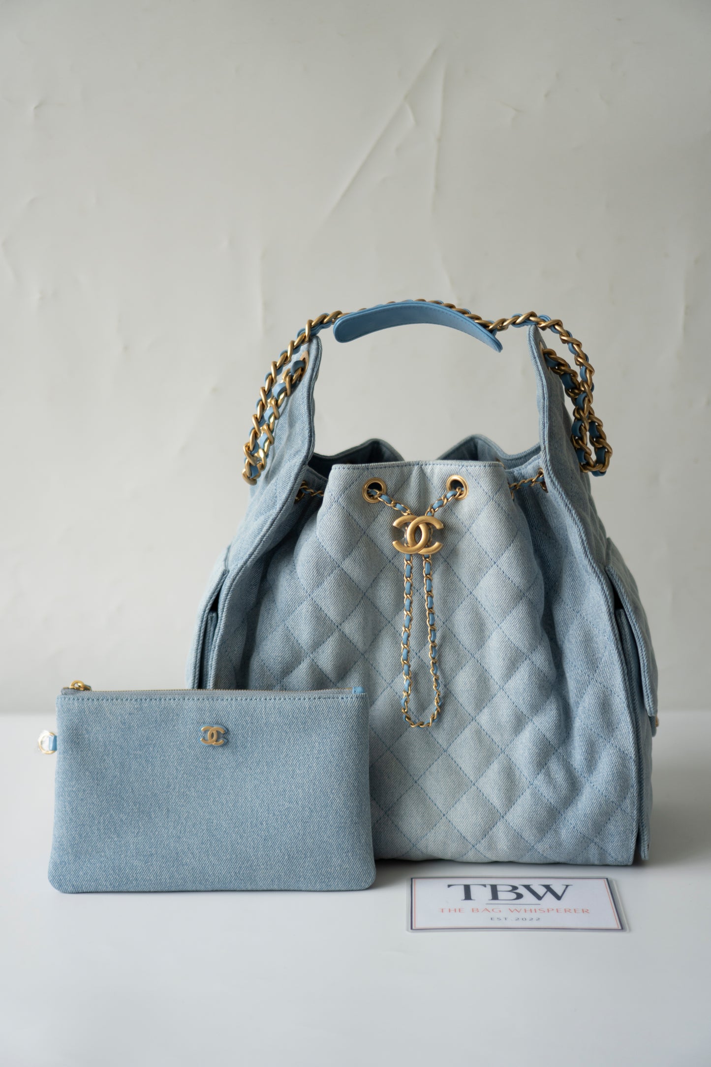 C25 Medium Drawstring Chain Bag – Washed Denim with Gold Hardware