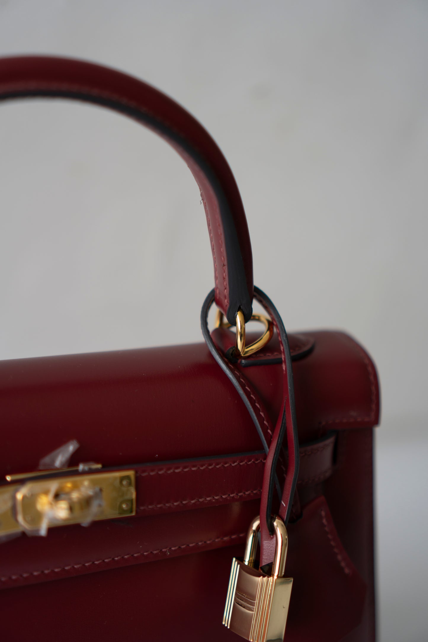 KL 25 – Rouge H Box Leather with Gold Hardware