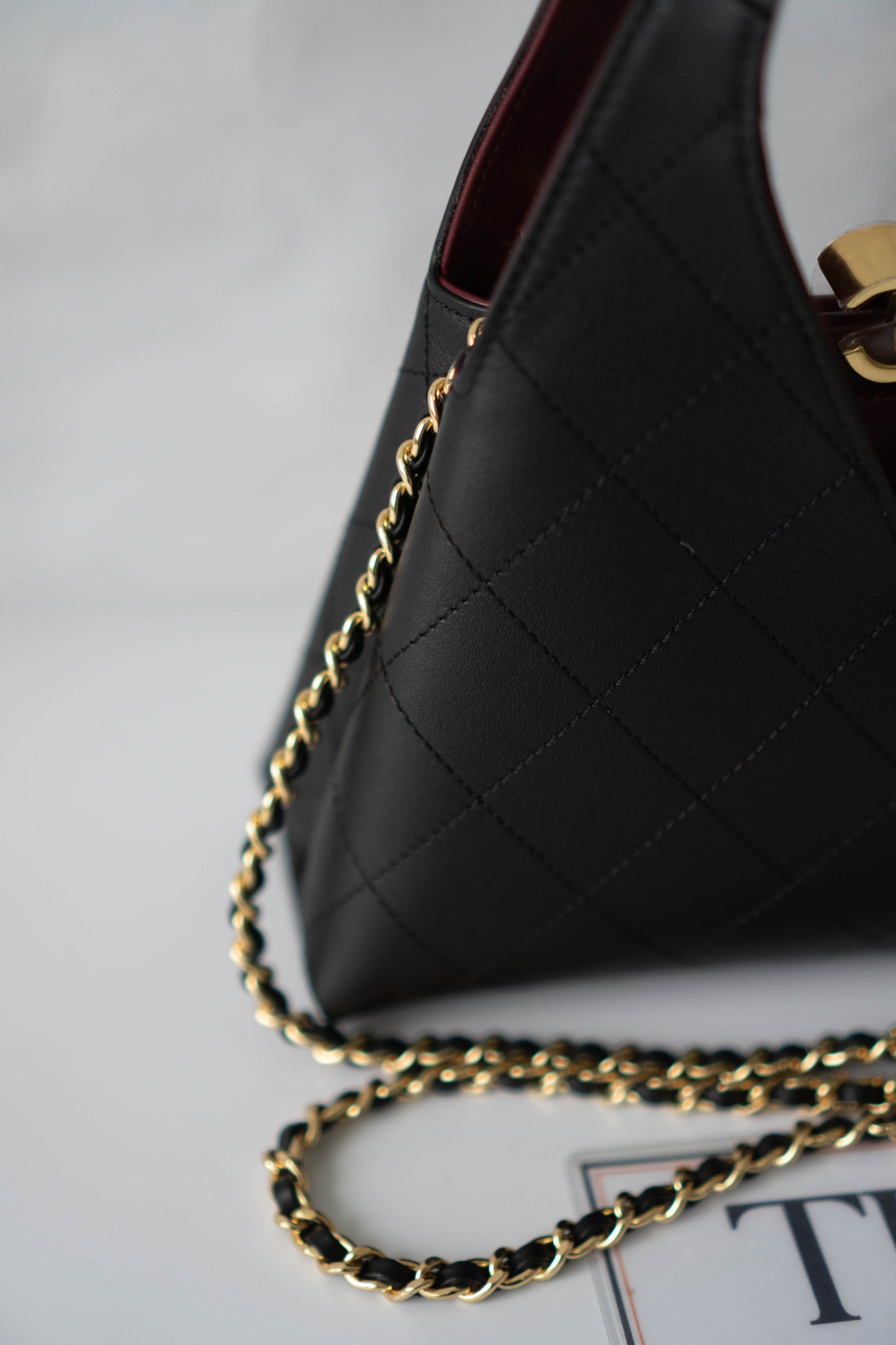 Chic Lady Quilted Triangle Tote – Black Grained Calfskin with Gold Hardware
