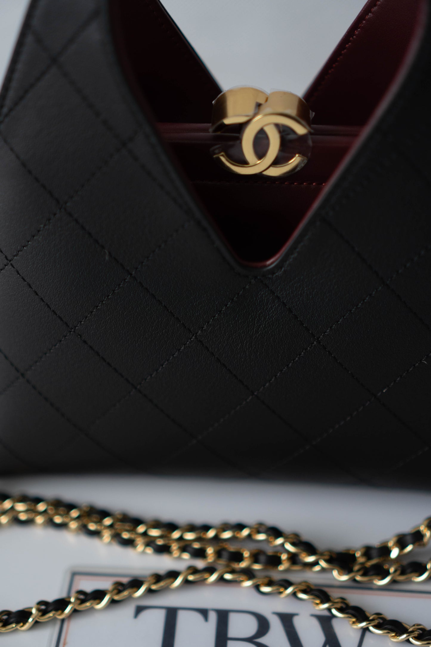 Chic Lady Quilted Triangle Tote – Black Grained Calfskin with Gold Hardware