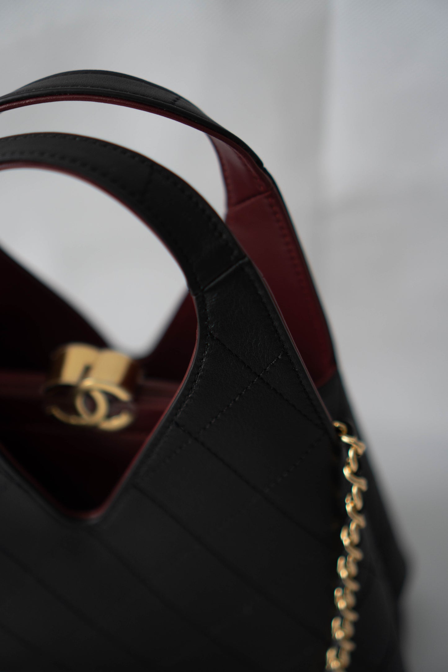 Chic Lady Quilted Triangle Tote – Black Grained Calfskin with Gold Hardware
