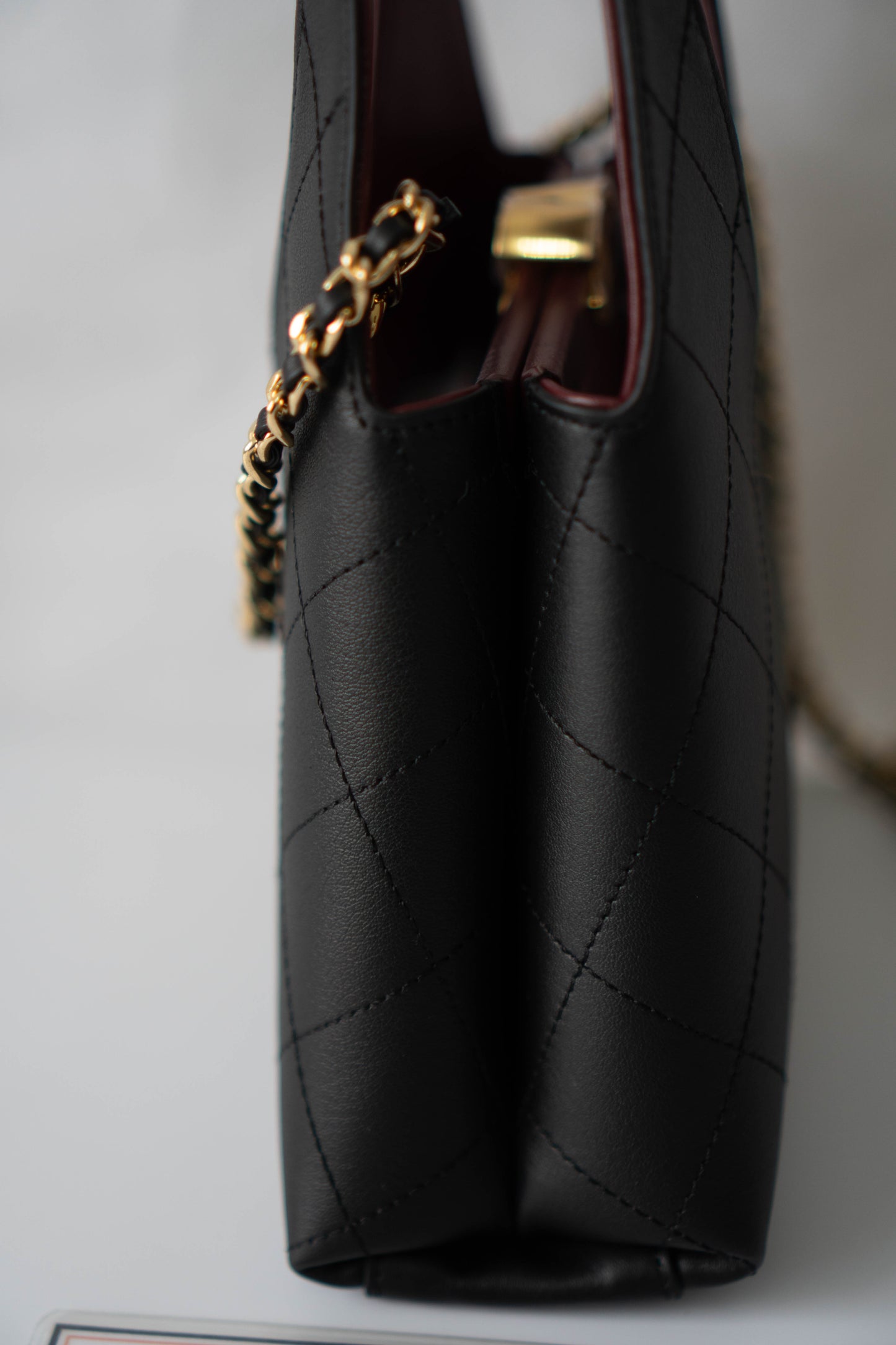 Chic Lady Quilted Triangle Tote – Black Grained Calfskin with Gold Hardware