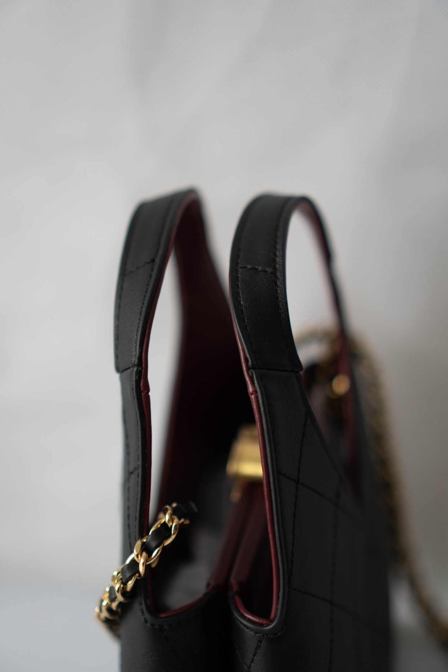 Chic Lady Quilted Triangle Tote – Black Grained Calfskin with Gold Hardware