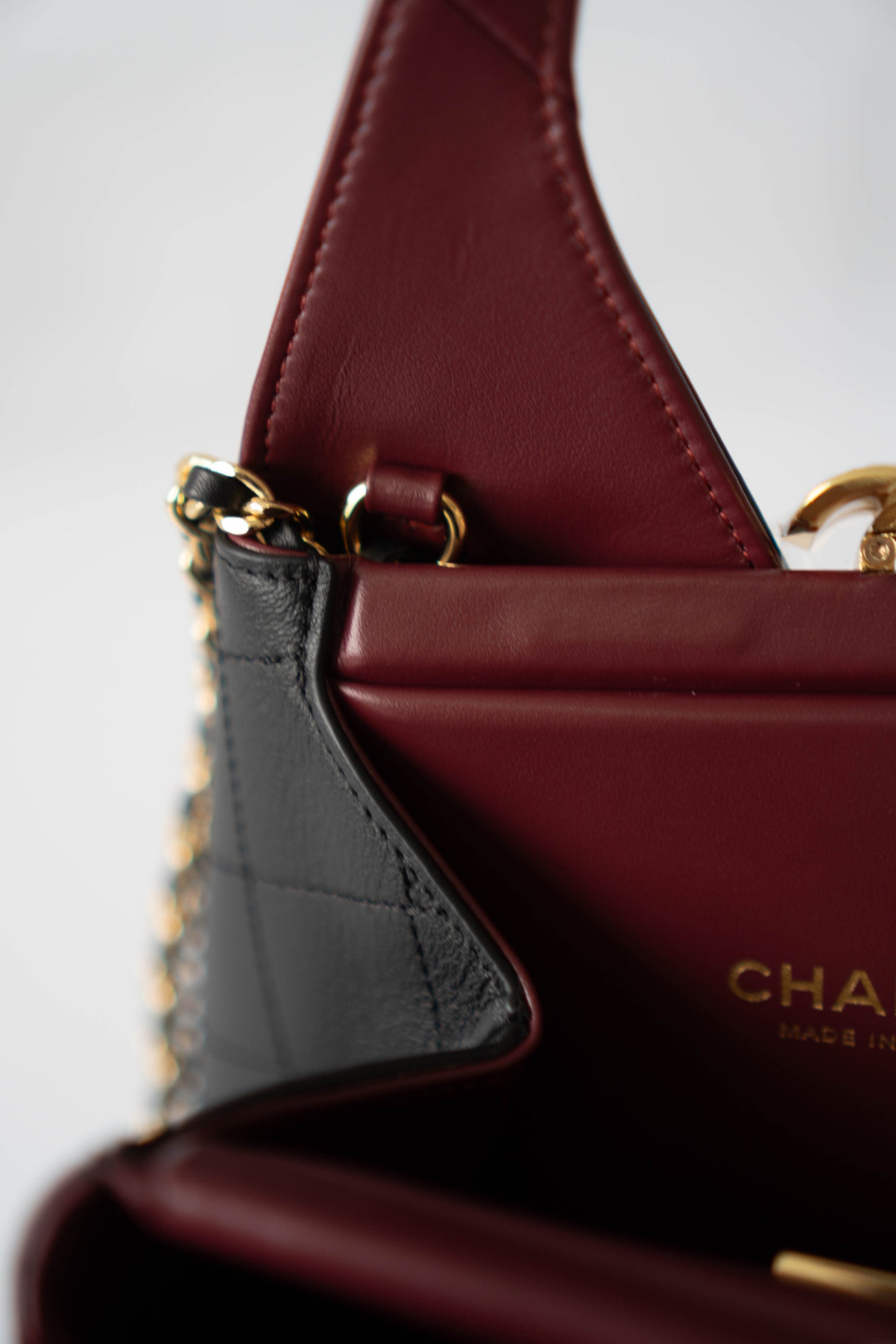 Chic Lady Quilted Triangle Tote – Black Grained Calfskin with Gold Hardware