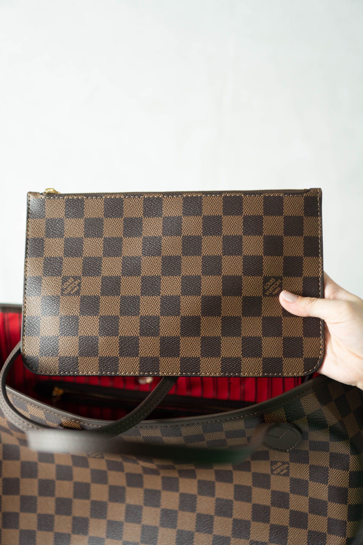 Neverfull MM – Damier Ebene Canvas with Red Interior
