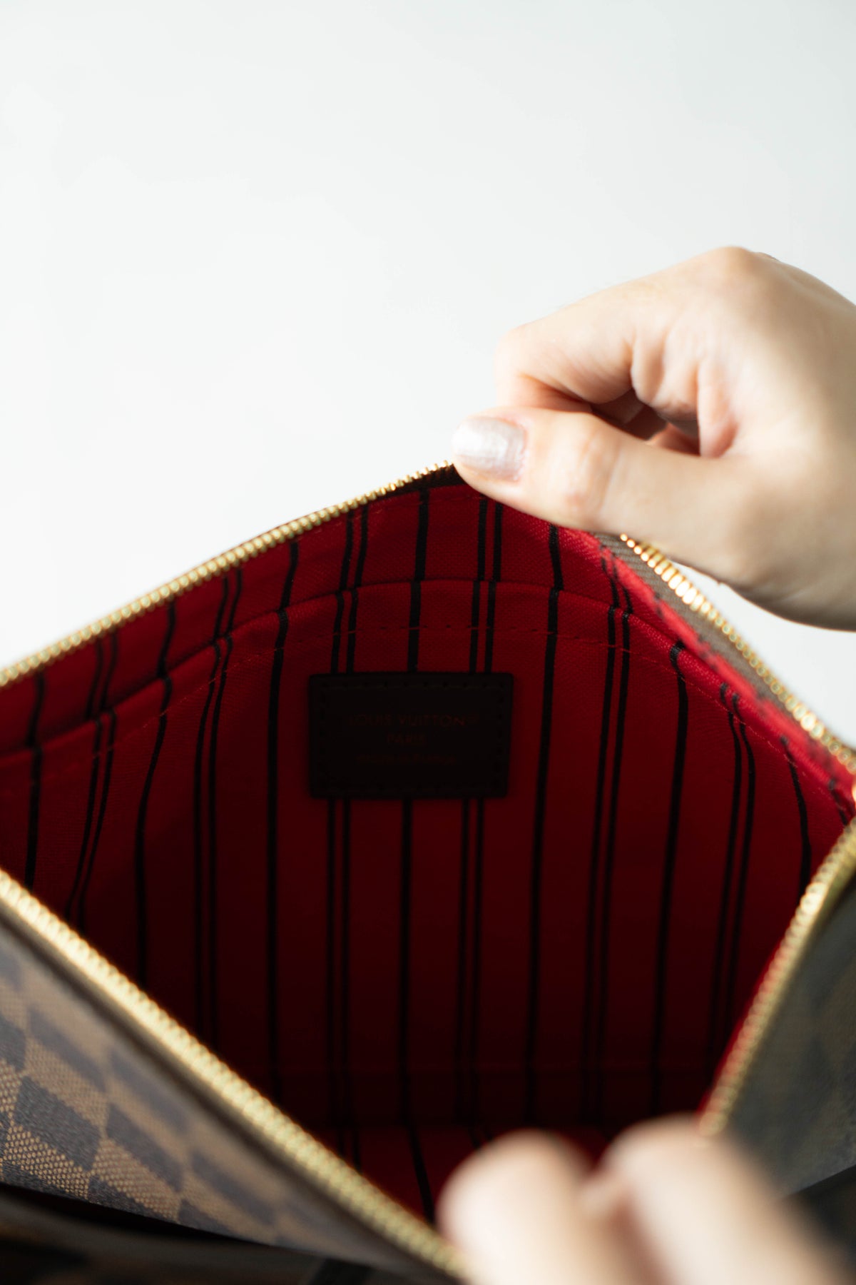Neverfull MM – Damier Ebene Canvas with Red Interior