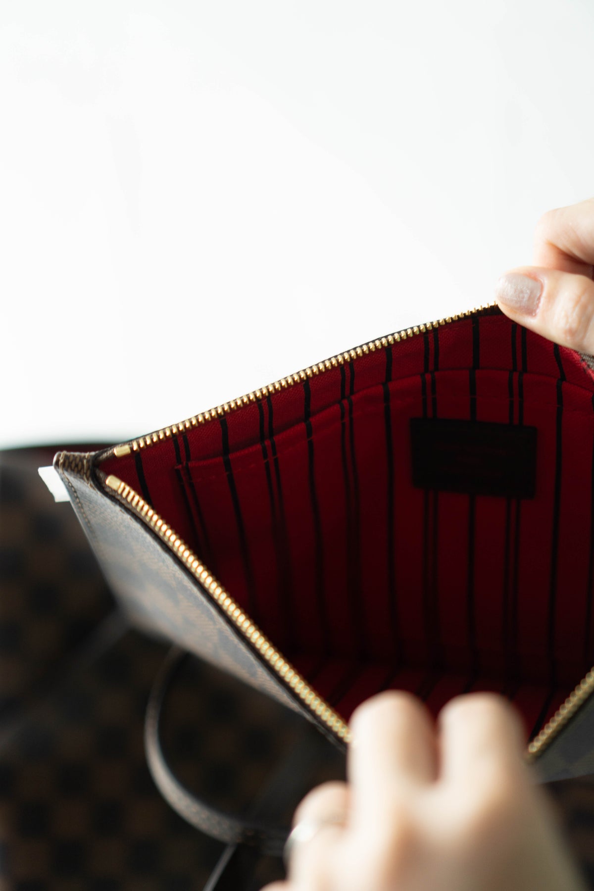 Neverfull MM – Damier Ebene Canvas with Red Interior