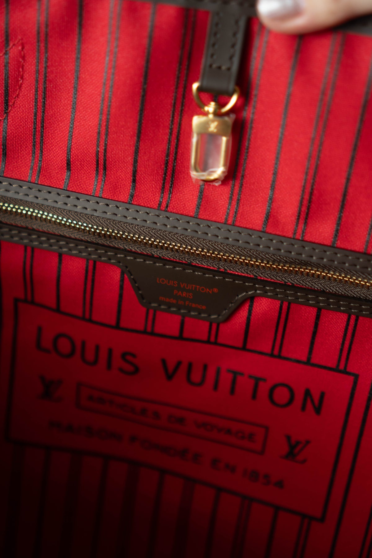 Neverfull MM – Damier Ebene Canvas with Red Interior