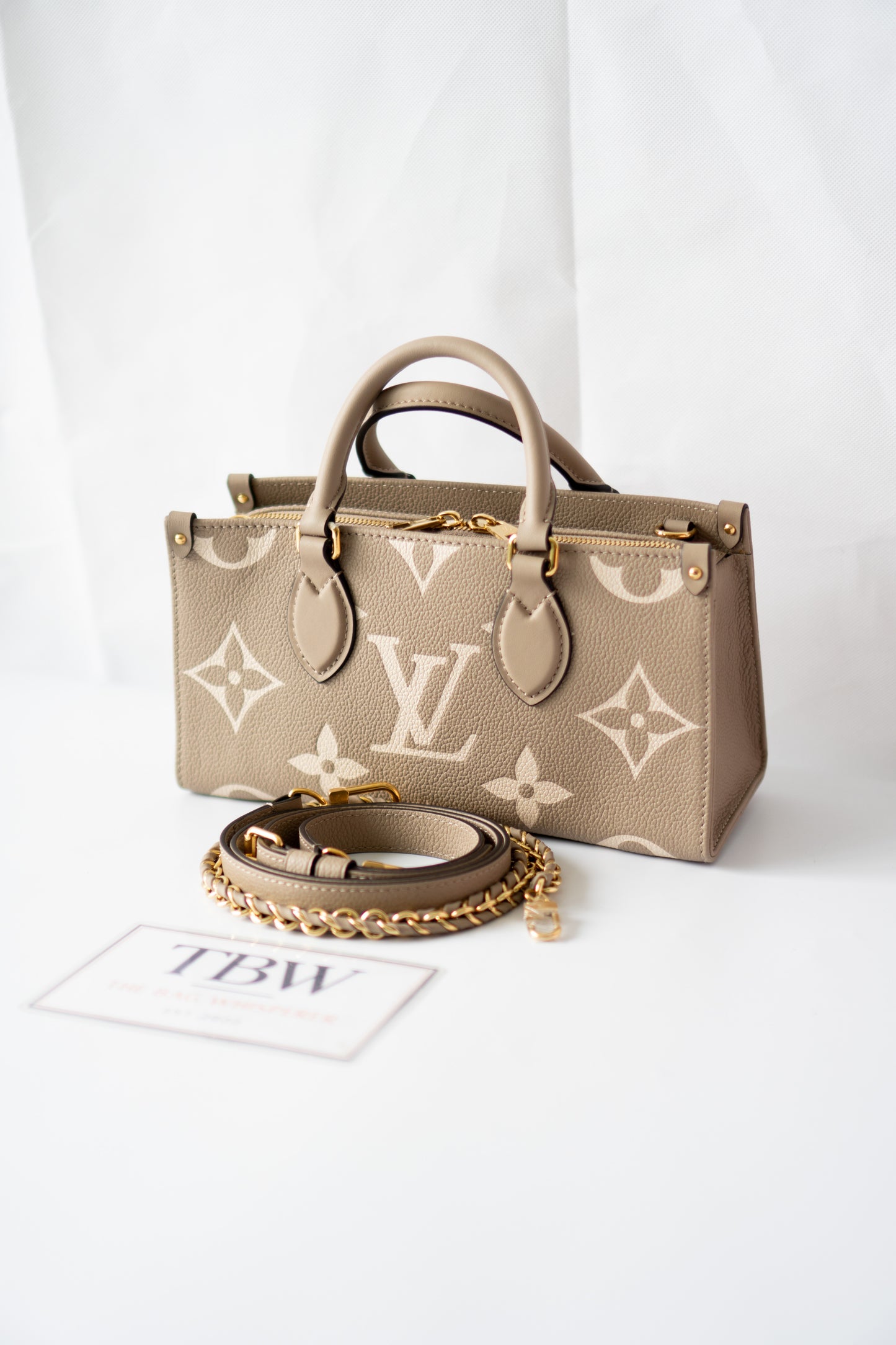 OnTheGo East-West Tote – Tourterelle Monogram Embossed Leather with Gold Hardware