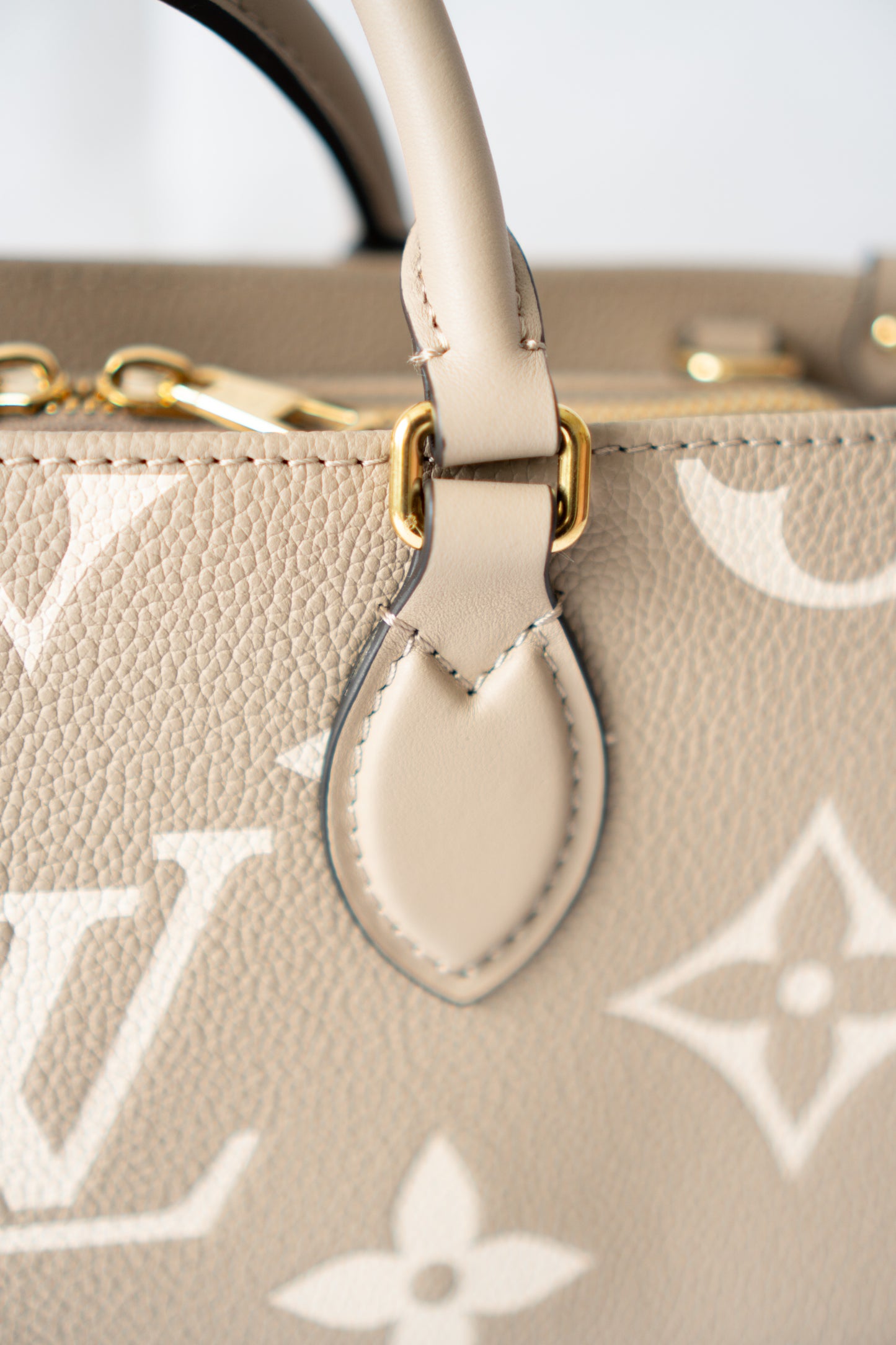 OnTheGo East-West Tote – Tourterelle Monogram Embossed Leather with Gold Hardware
