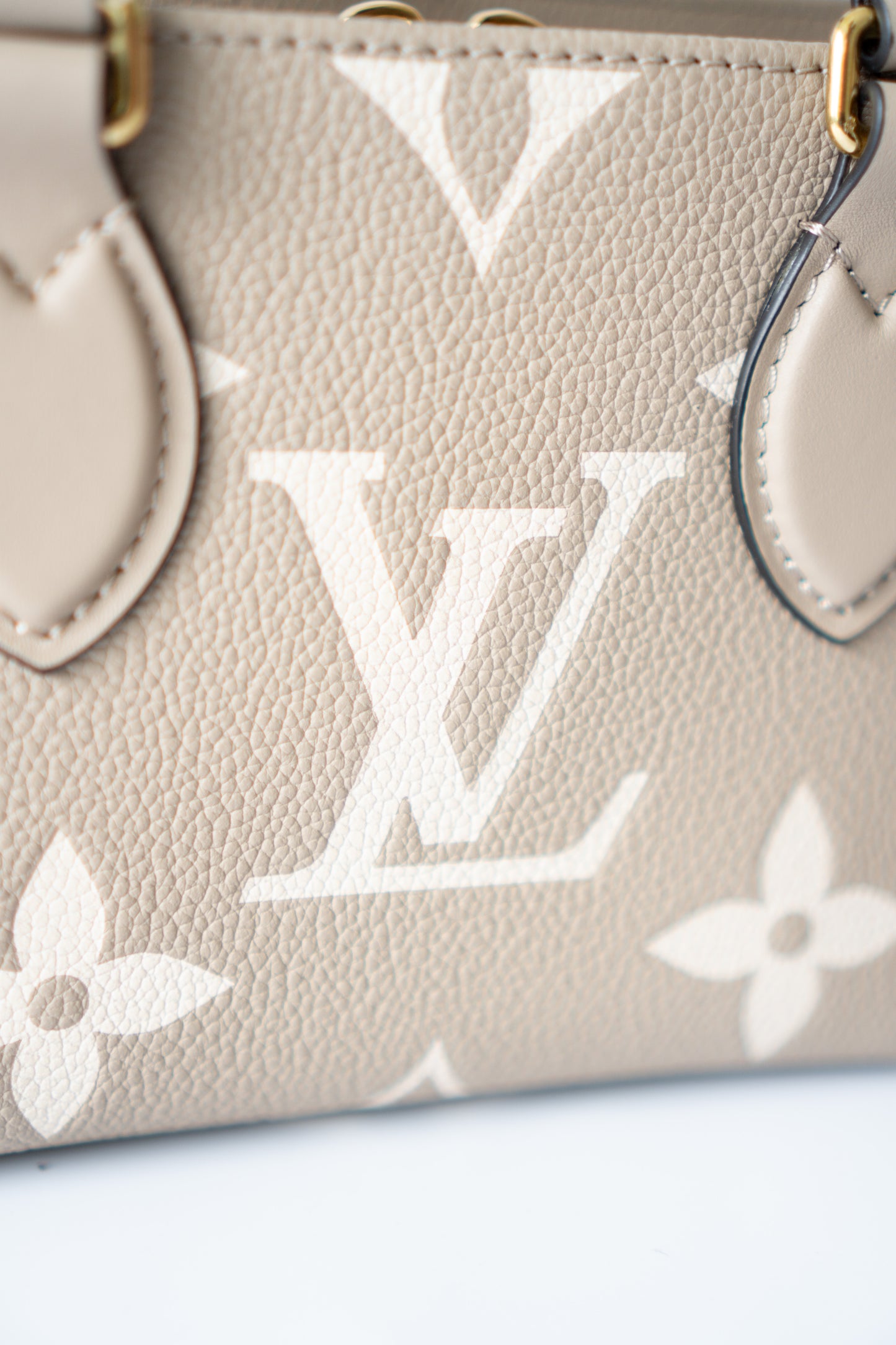OnTheGo East-West Tote – Tourterelle Monogram Embossed Leather with Gold Hardware