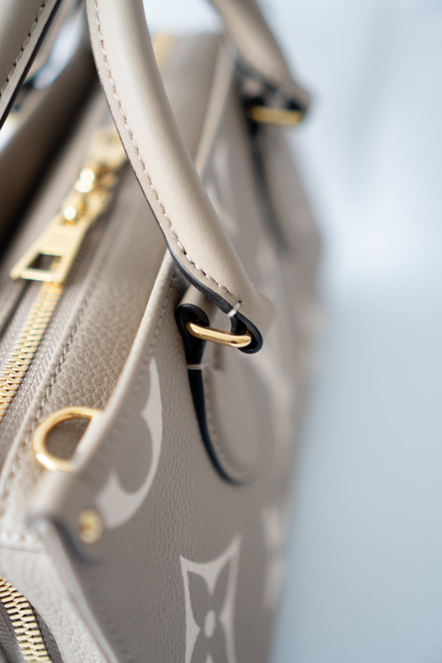 OnTheGo East-West Tote – Tourterelle Monogram Embossed Leather with Gold Hardware