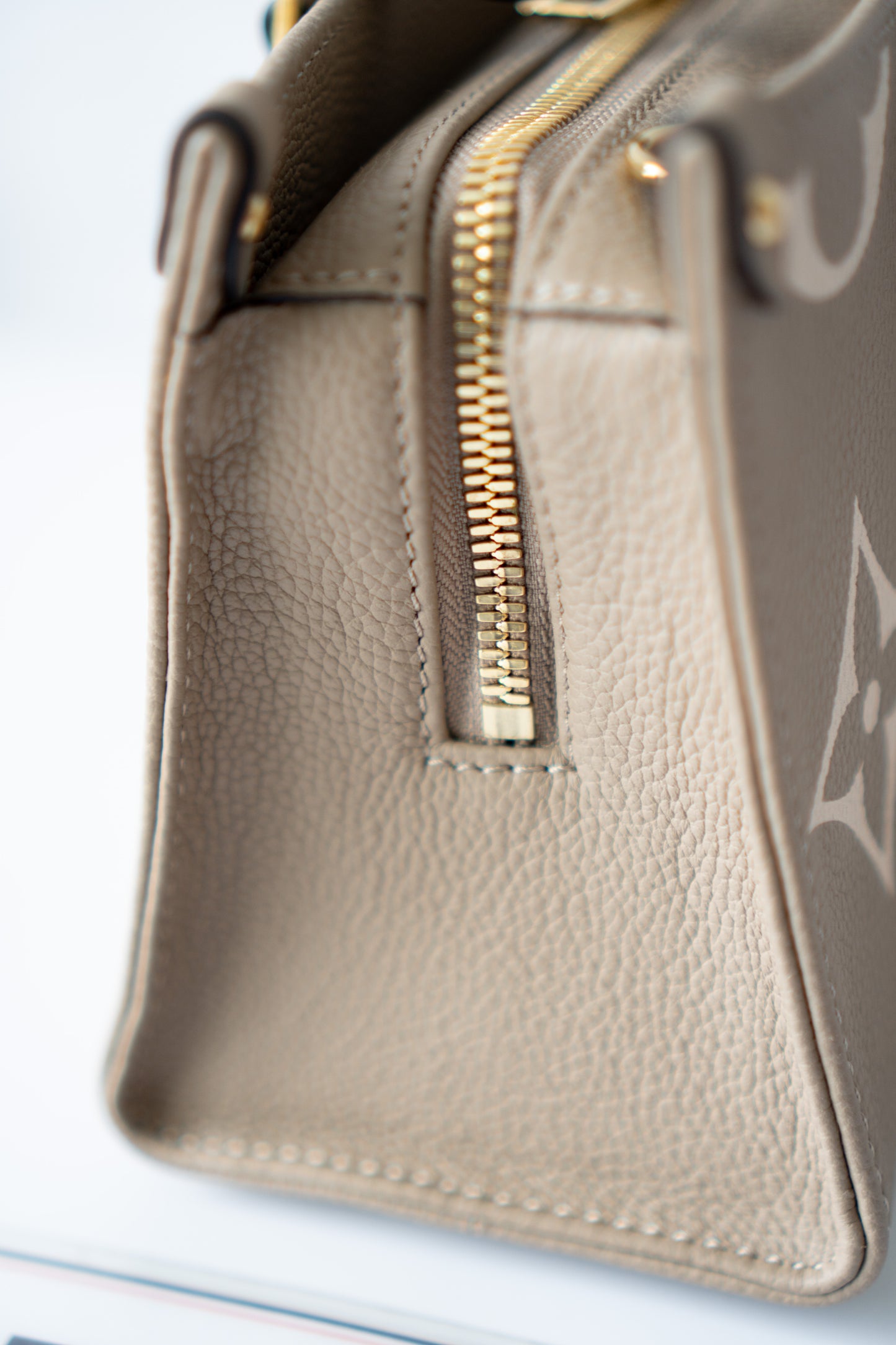 OnTheGo East-West Tote – Tourterelle Monogram Embossed Leather with Gold Hardware
