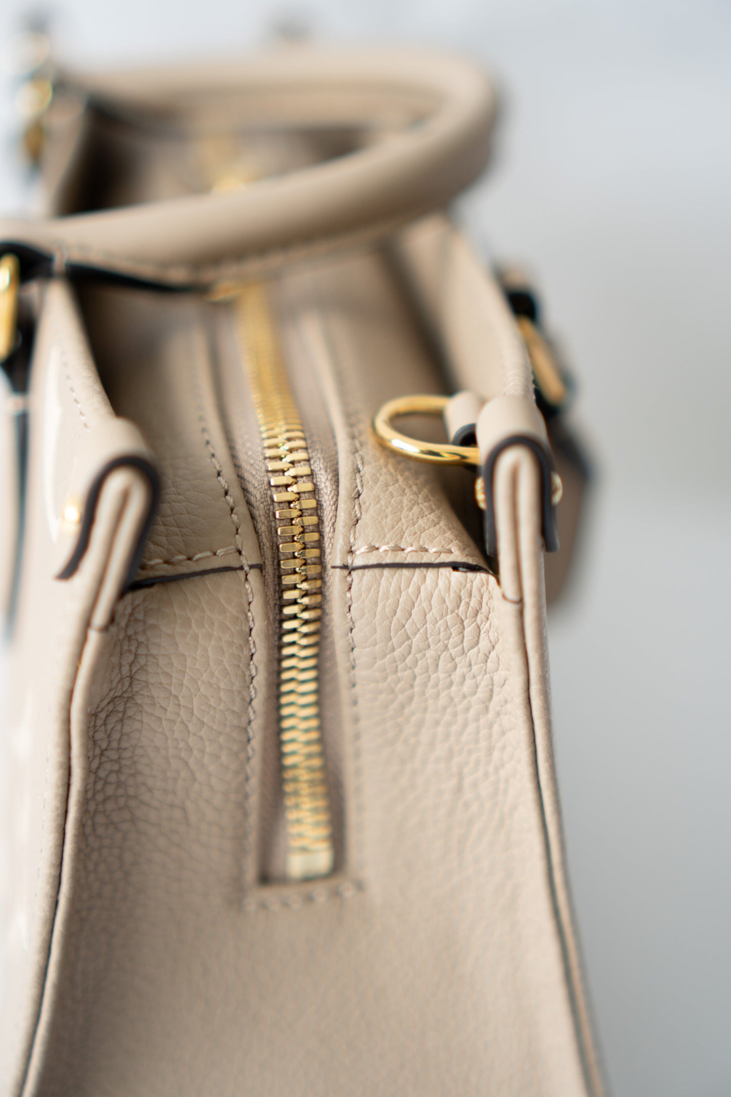 OnTheGo East-West Tote – Tourterelle Monogram Embossed Leather with Gold Hardware