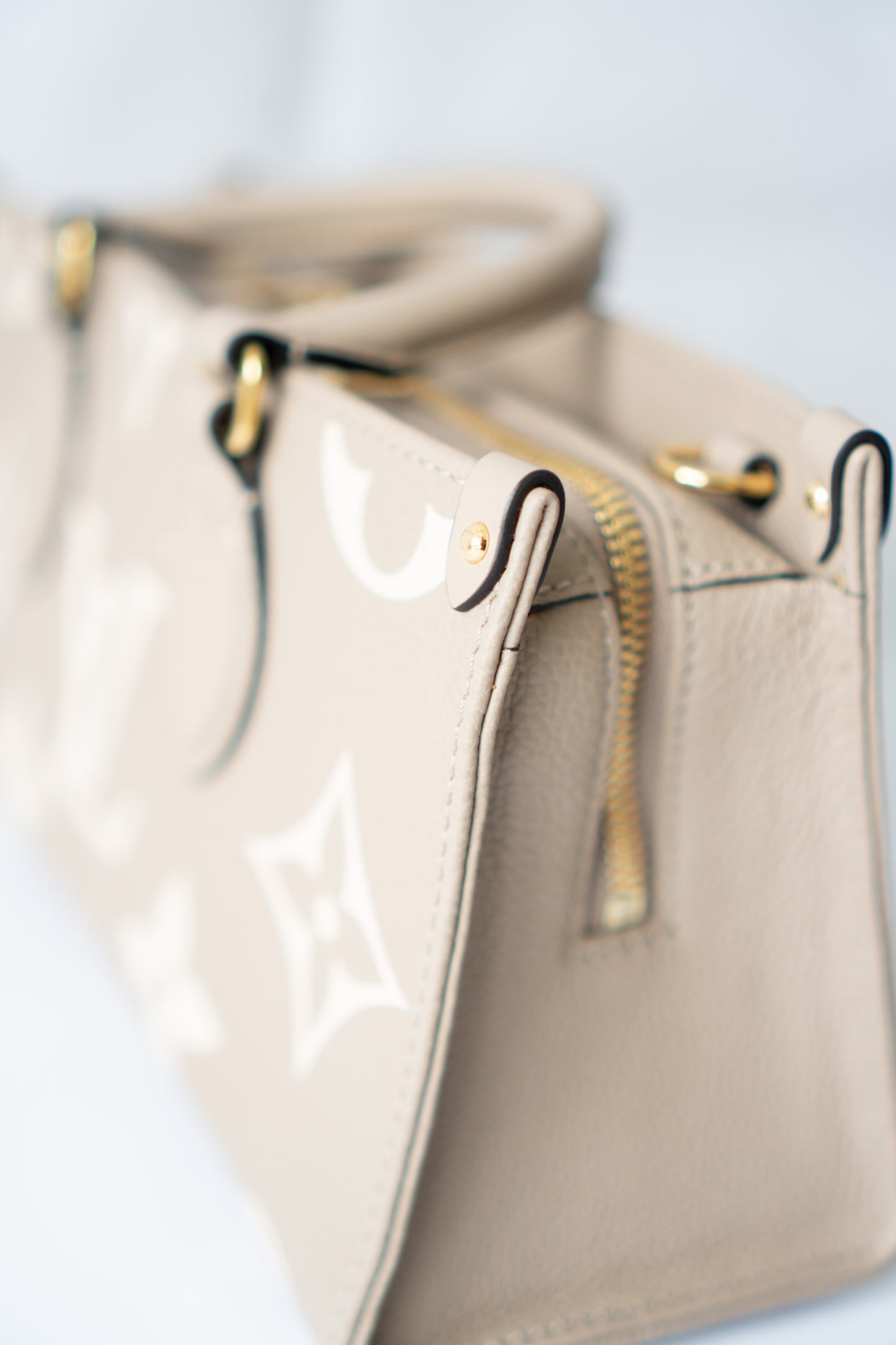 OnTheGo East-West Tote – Tourterelle Monogram Embossed Leather with Gold Hardware