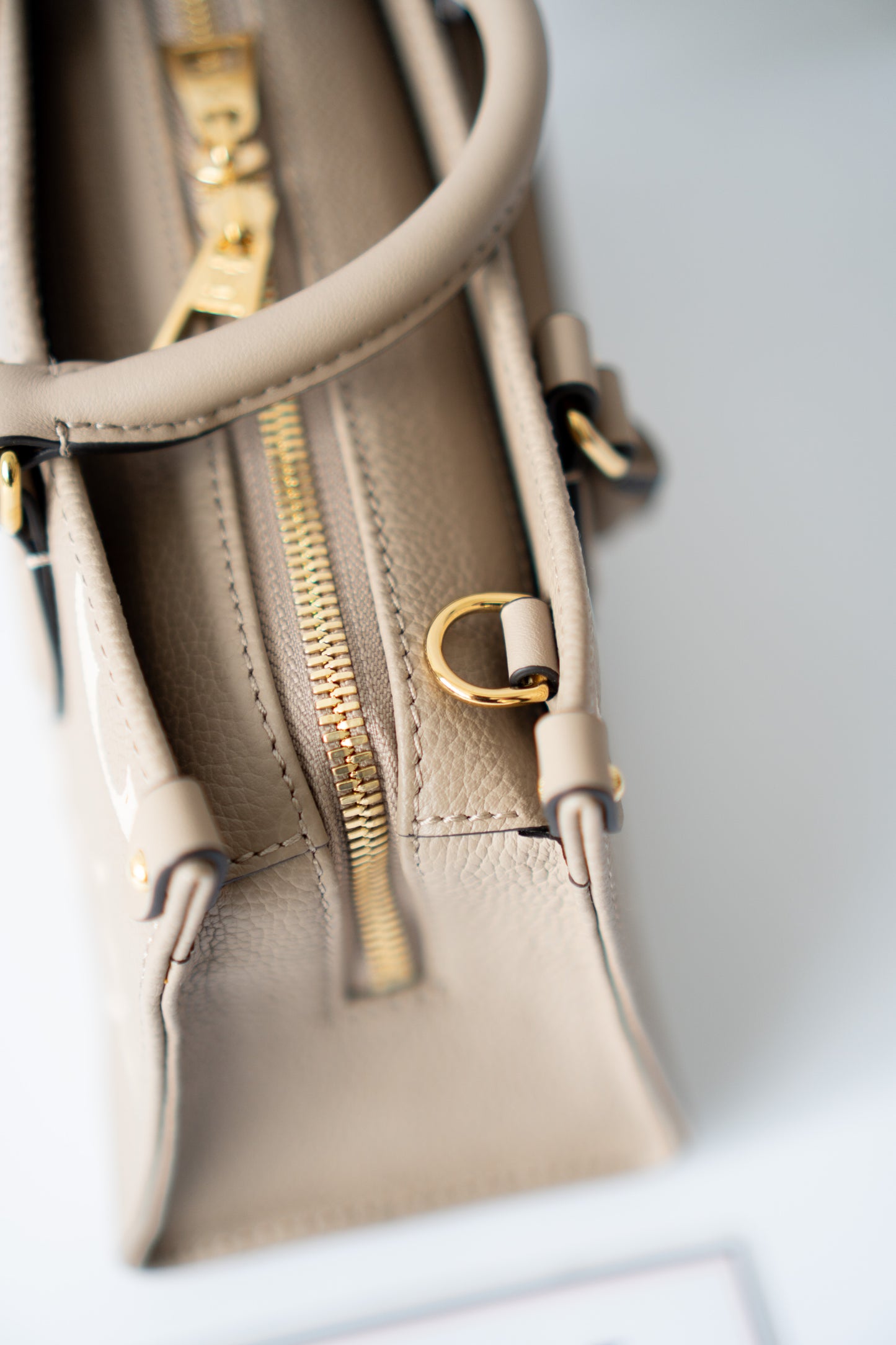 OnTheGo East-West Tote – Tourterelle Monogram Embossed Leather with Gold Hardware