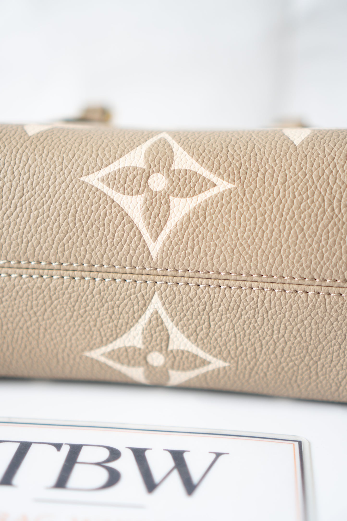 OnTheGo East-West Tote – Tourterelle Monogram Embossed Leather with Gold Hardware