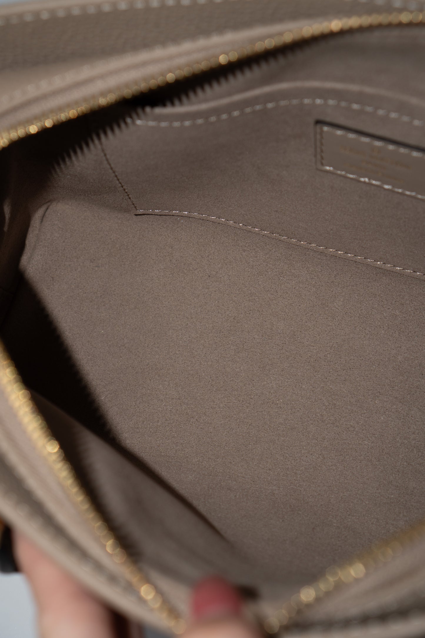 OnTheGo East-West Tote – Tourterelle Monogram Embossed Leather with Gold Hardware