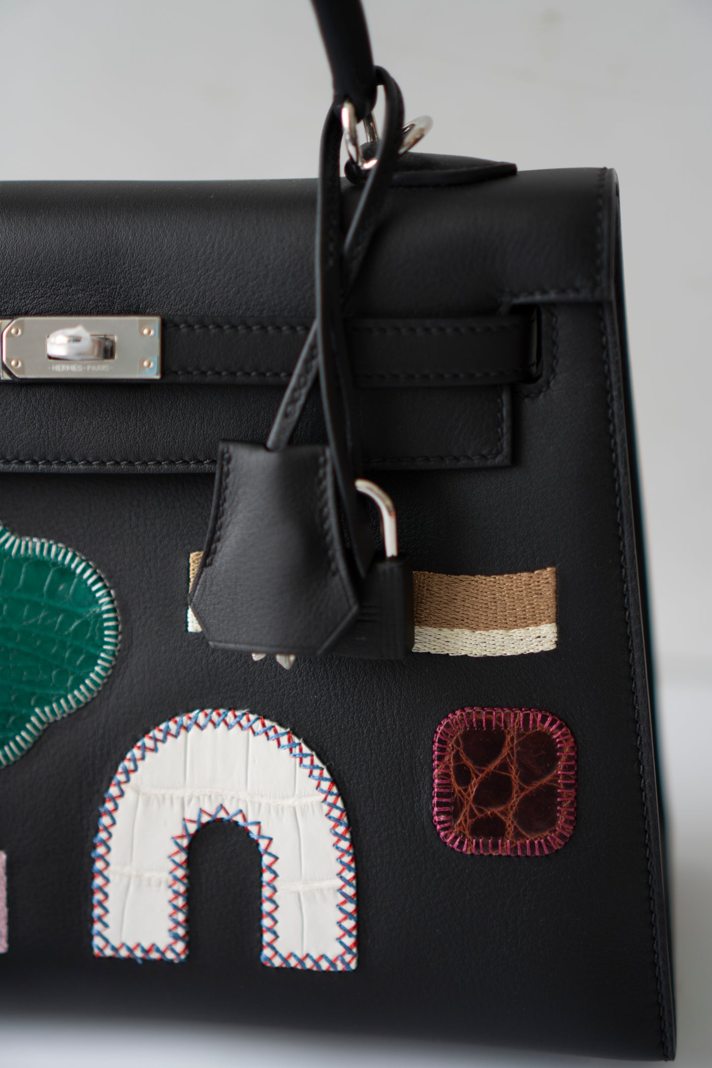 Kelly 25 – Black Volupto Leather with Exotic Croc Patches