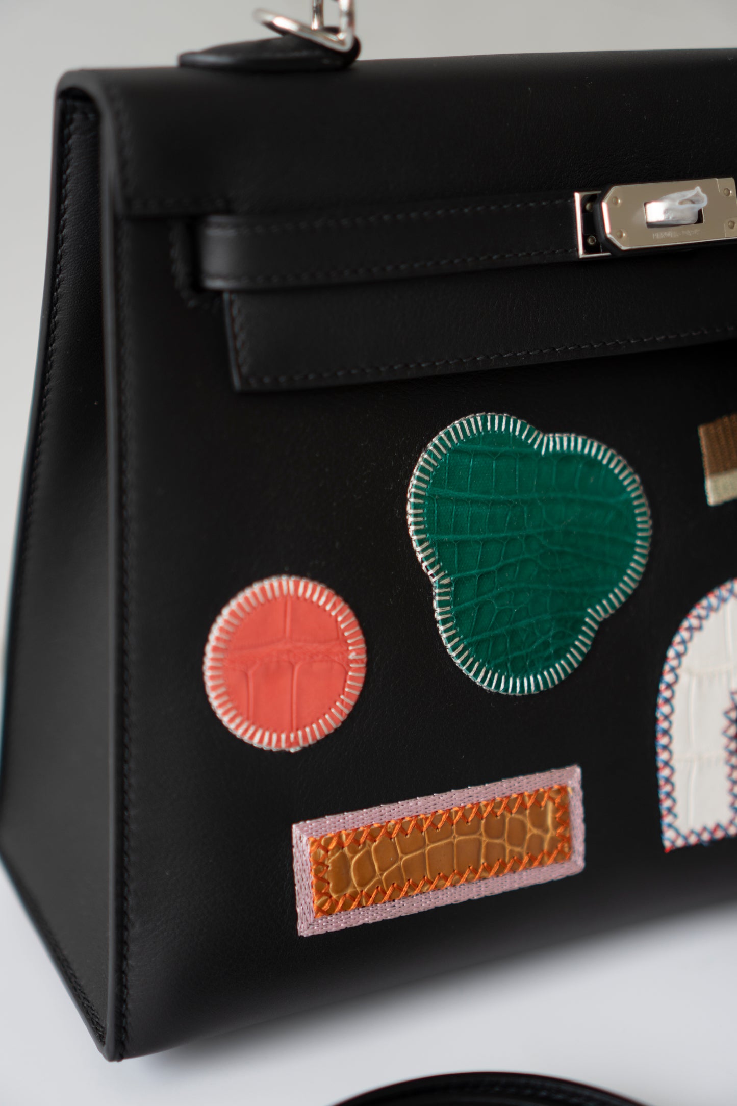 Kelly 25 – Black Volupto Leather with Exotic Croc Patches