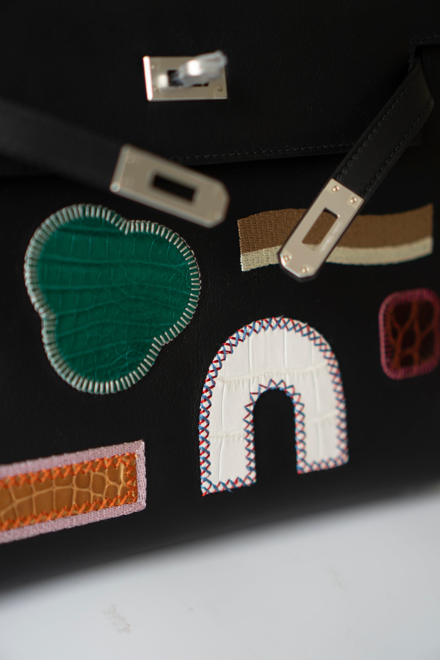 Kelly 25 – Black Volupto Leather with Exotic Croc Patches