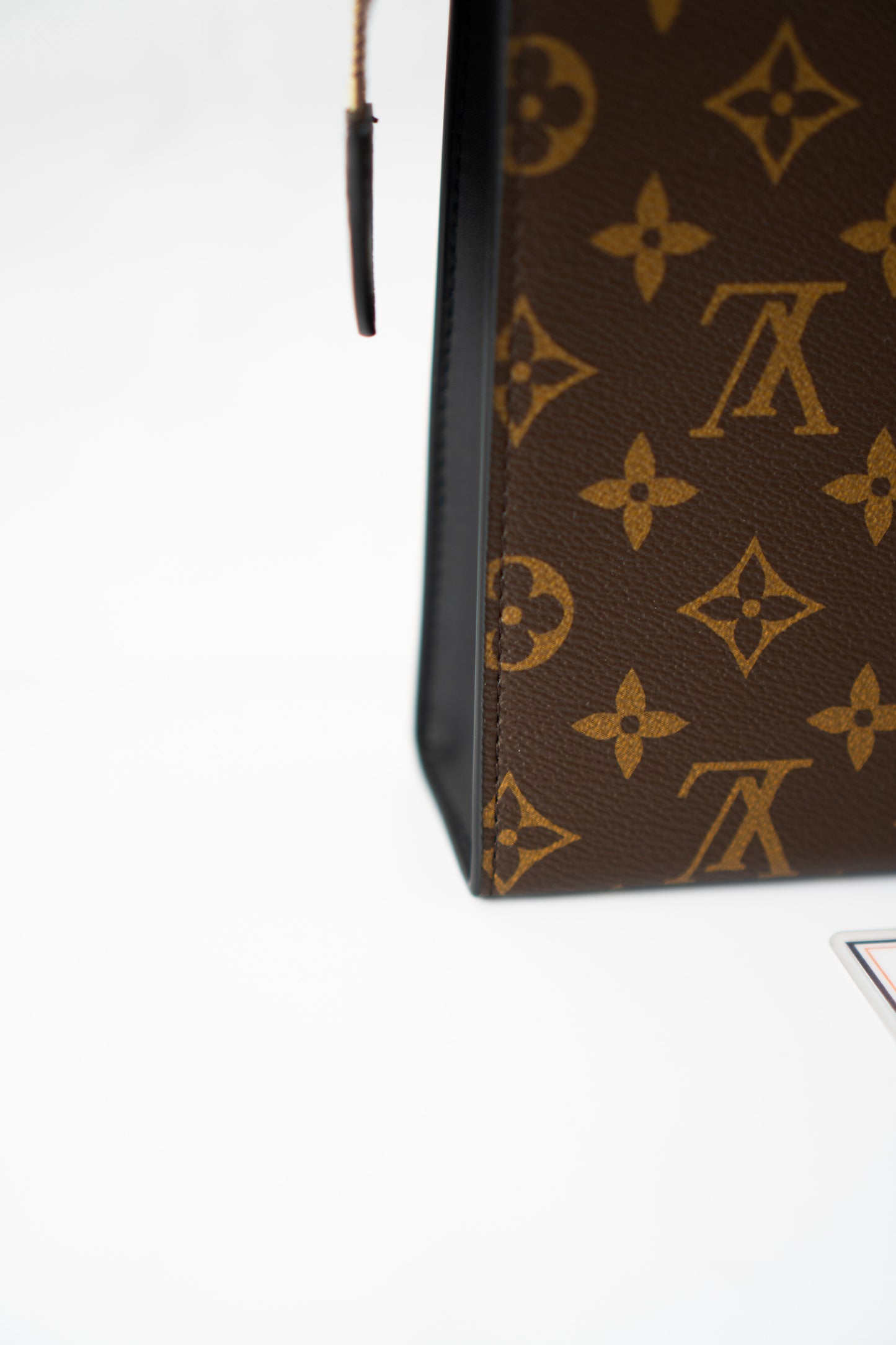 Structured Travel Pouch – Monogram Canvas with Black Leather Trim
