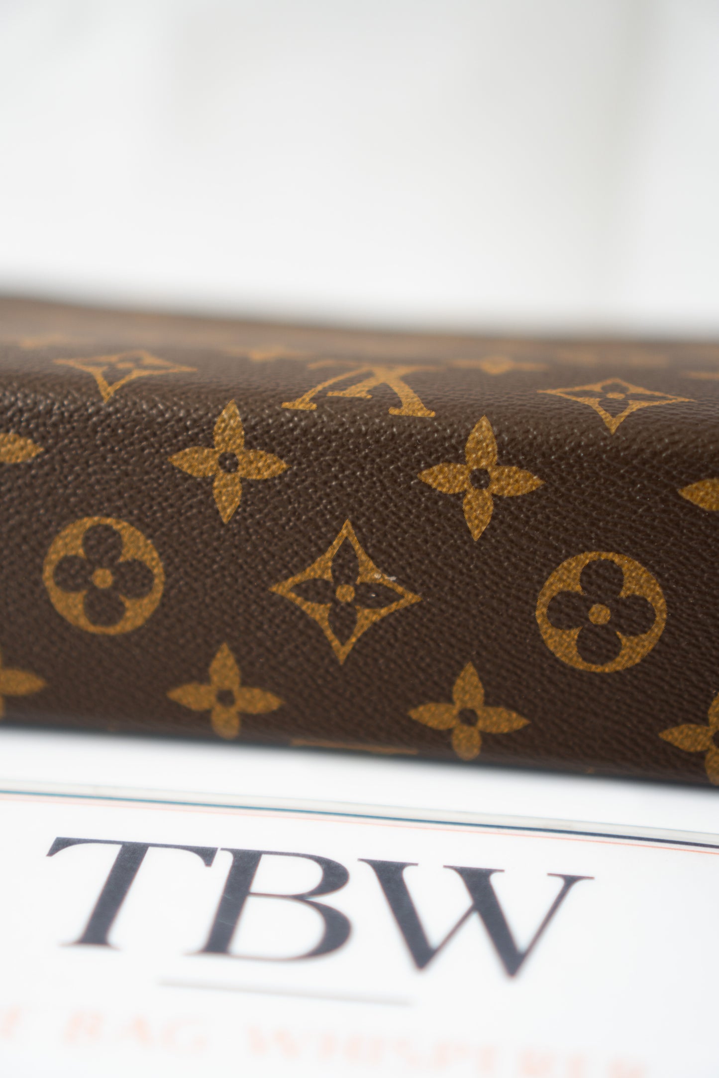 Structured Travel Pouch – Monogram Canvas with Black Leather Trim