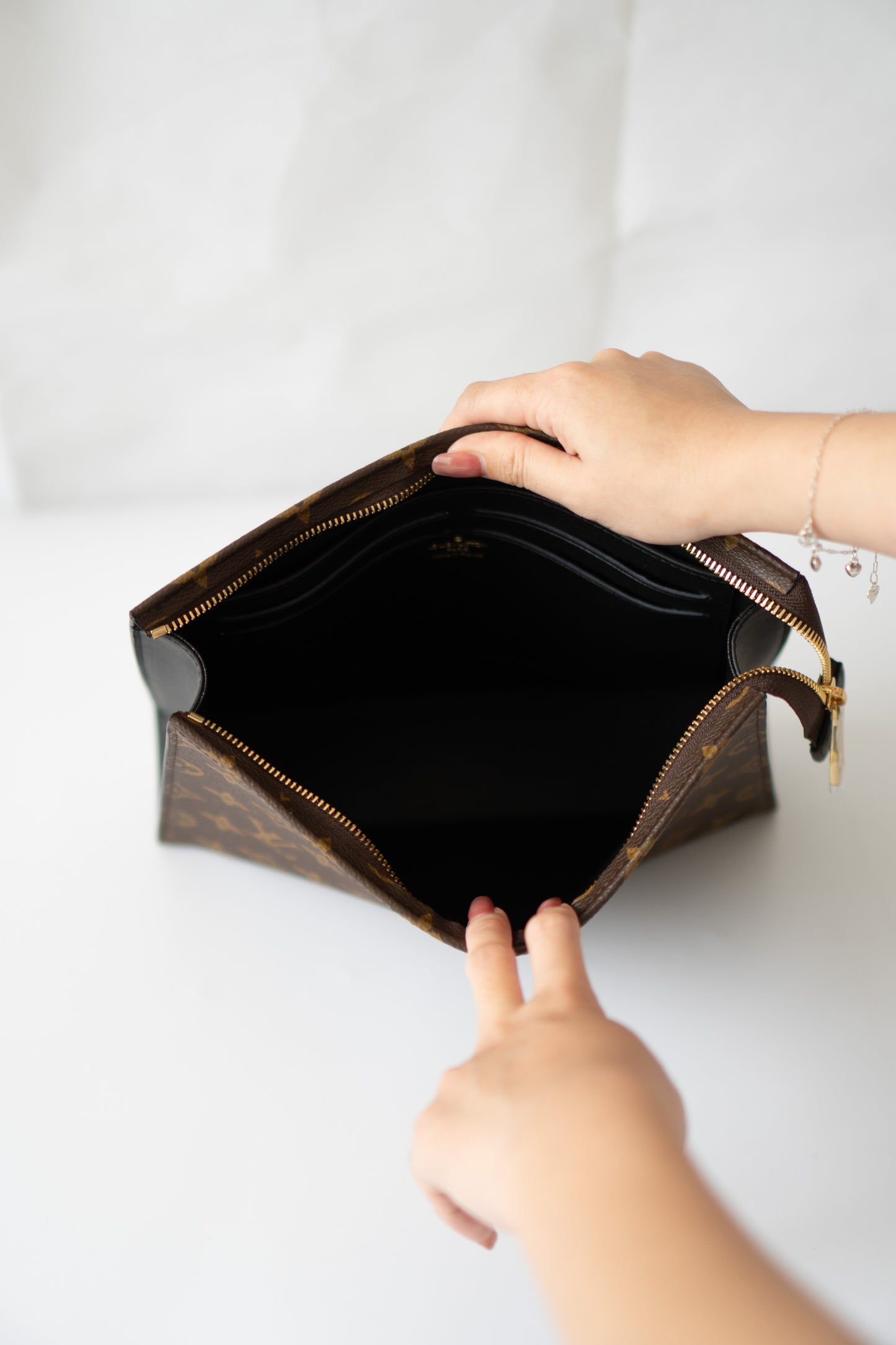 Structured Travel Pouch – Monogram Canvas with Black Leather Trim