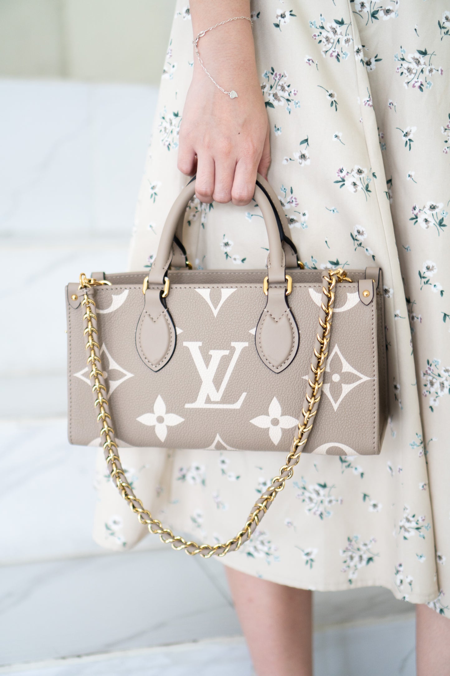 OnTheGo East-West Tote – Tourterelle Monogram Embossed Leather with Gold Hardware