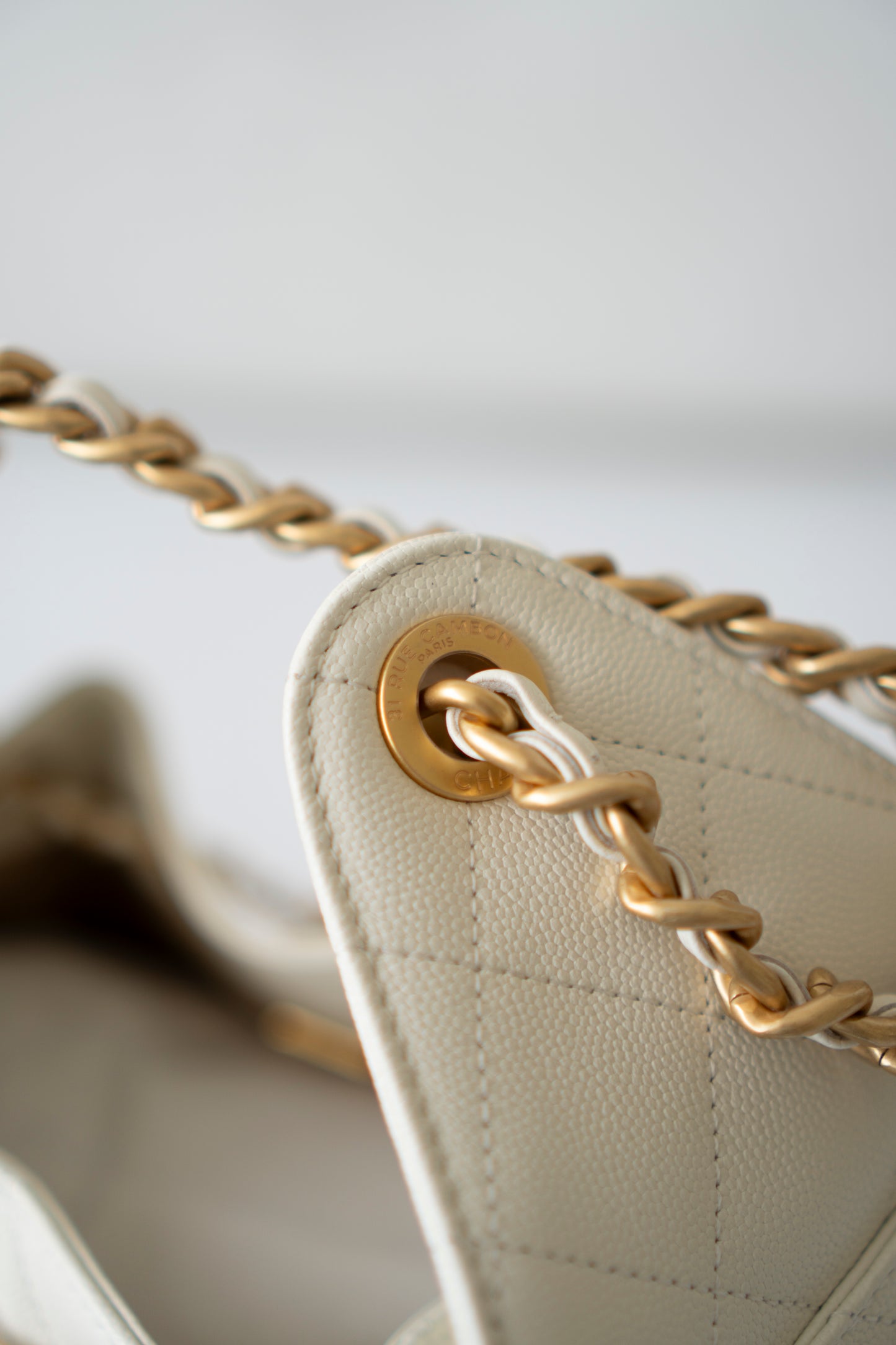 C25 Small – White Caviar Leather with Metal Drawstring Chain Strap