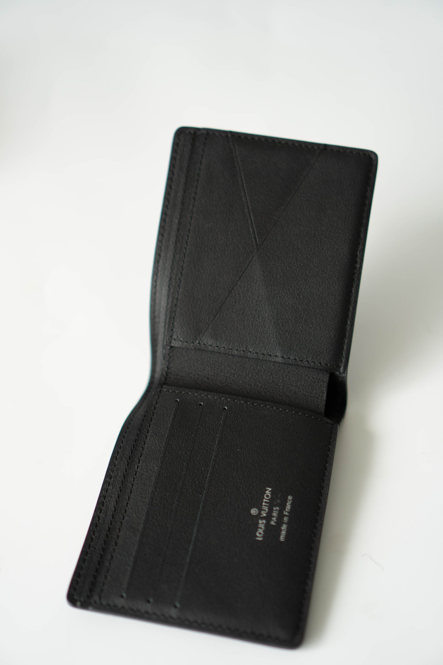 Multiple Wallet in Noir Calfskin leather with Black LV Aerogram (Pre-loved)